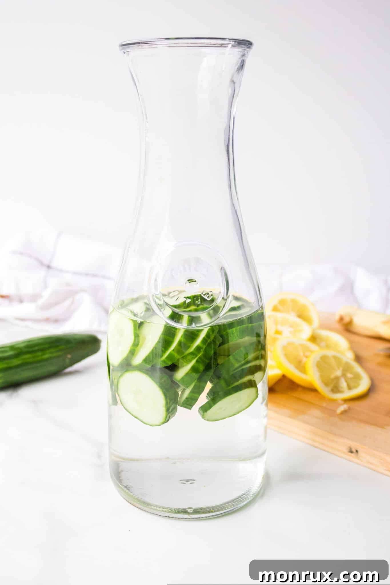 making cucumber lemon ginger water.