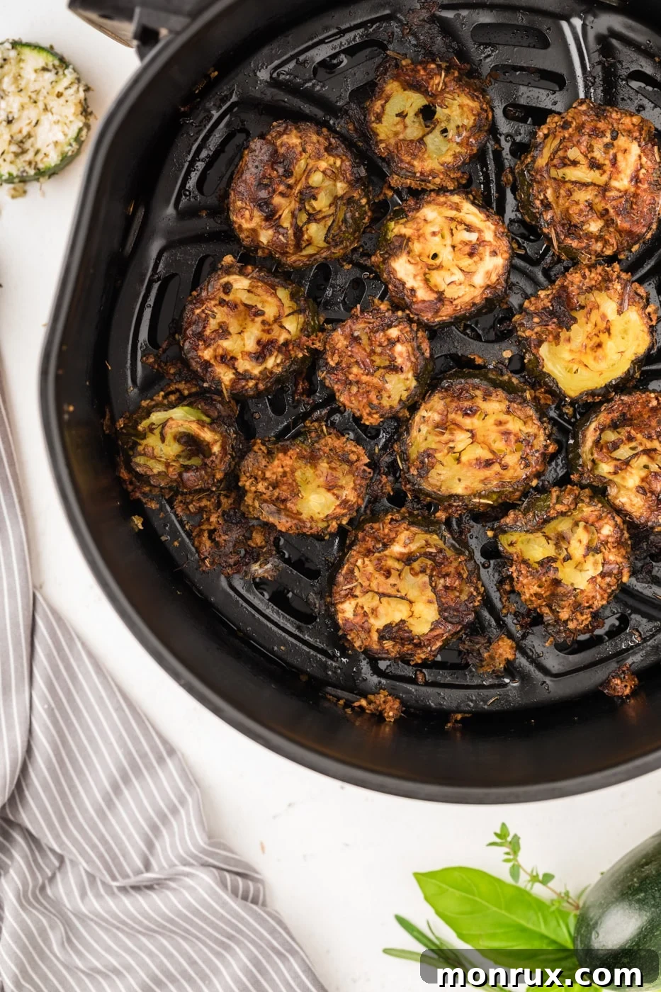 Close-up of crispy zucchini chips with parmesan cheese.