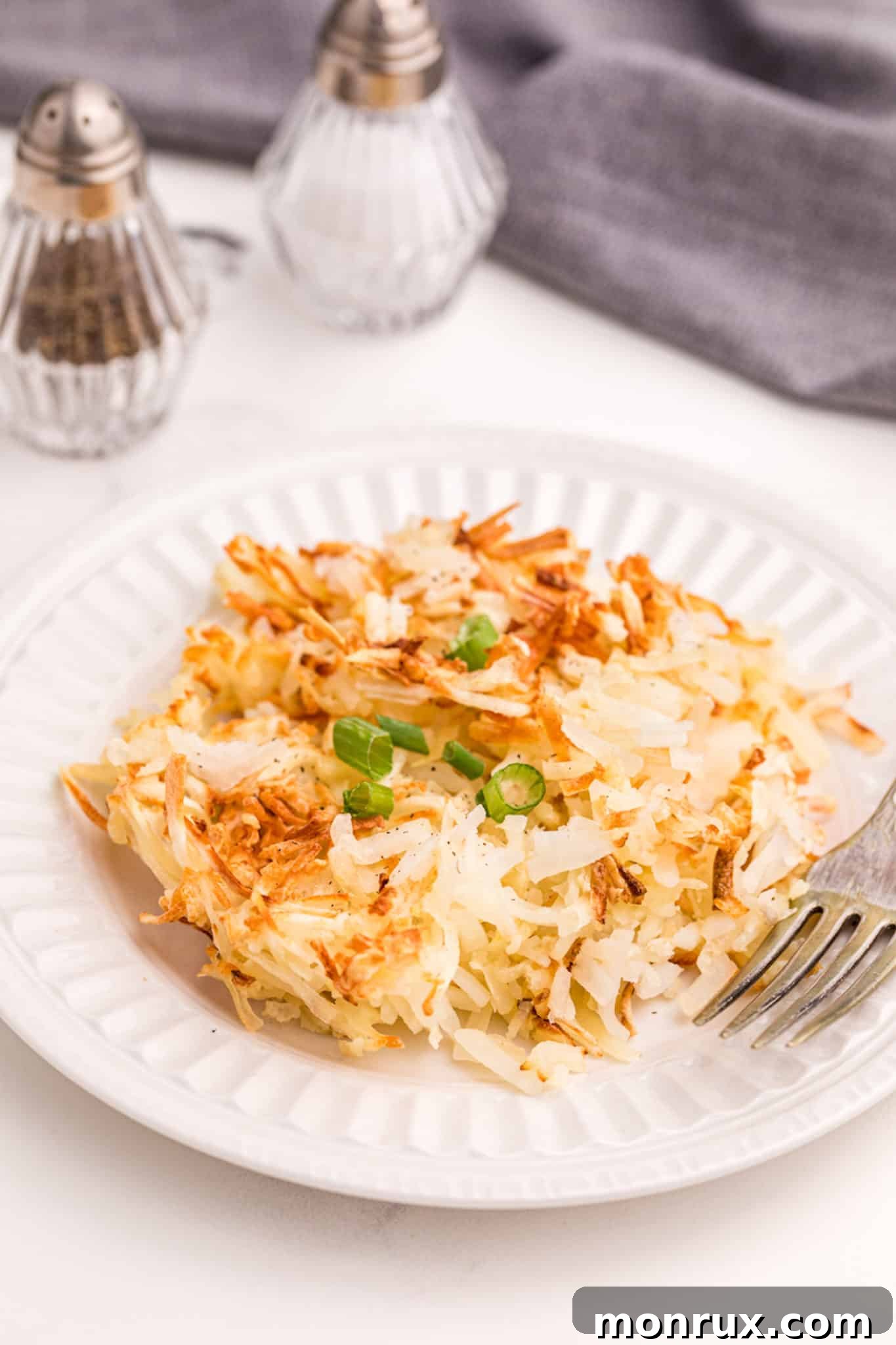 Perfectly air-fried hash browns on a plate, ready to be enjoyed.