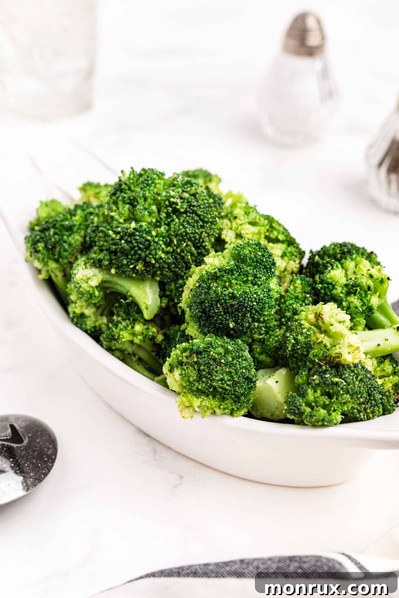 cooked air fryer frozen broccoli in a serving dish.