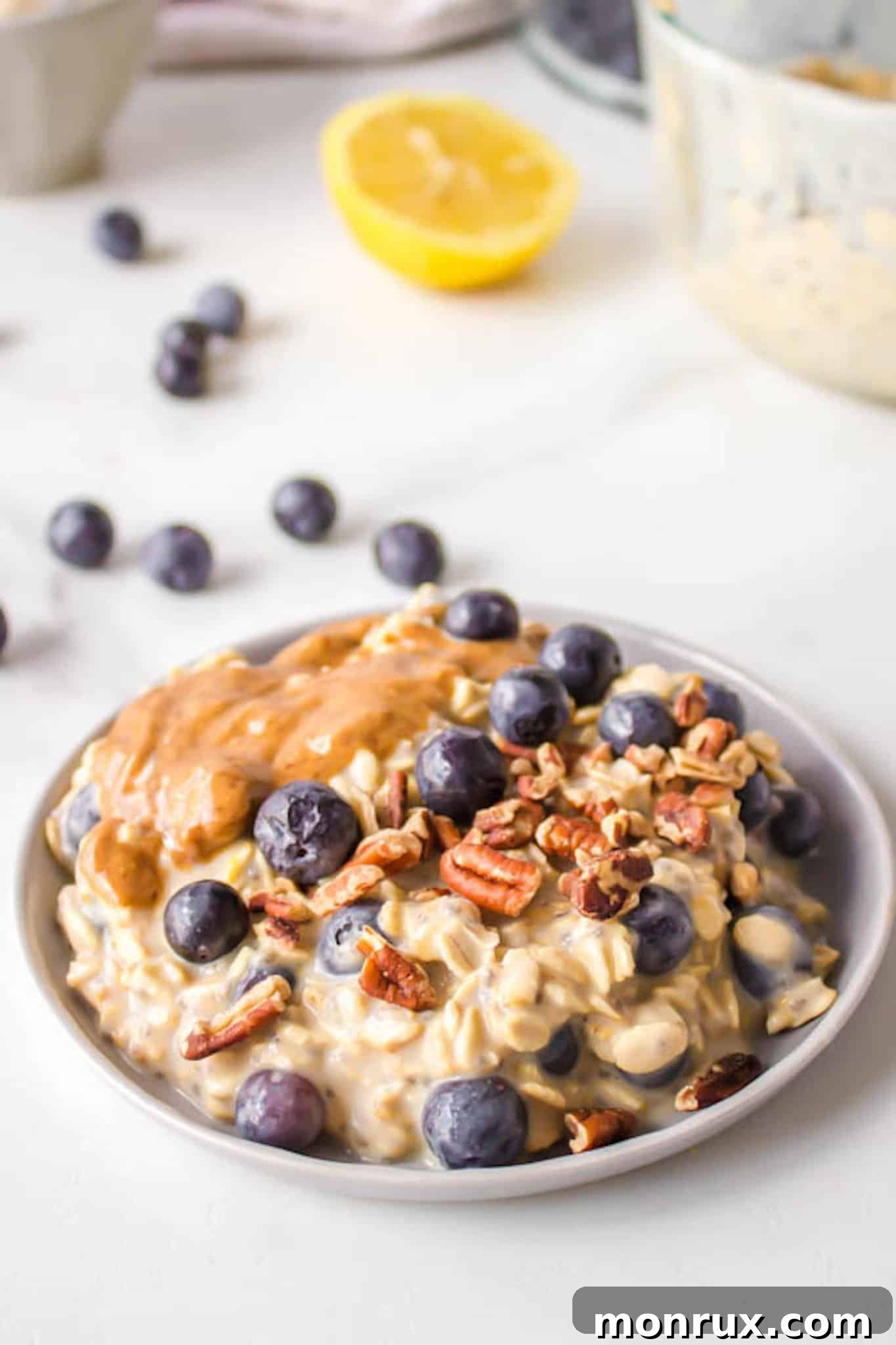 blueberry oatmeal served with nuts and nut butter.