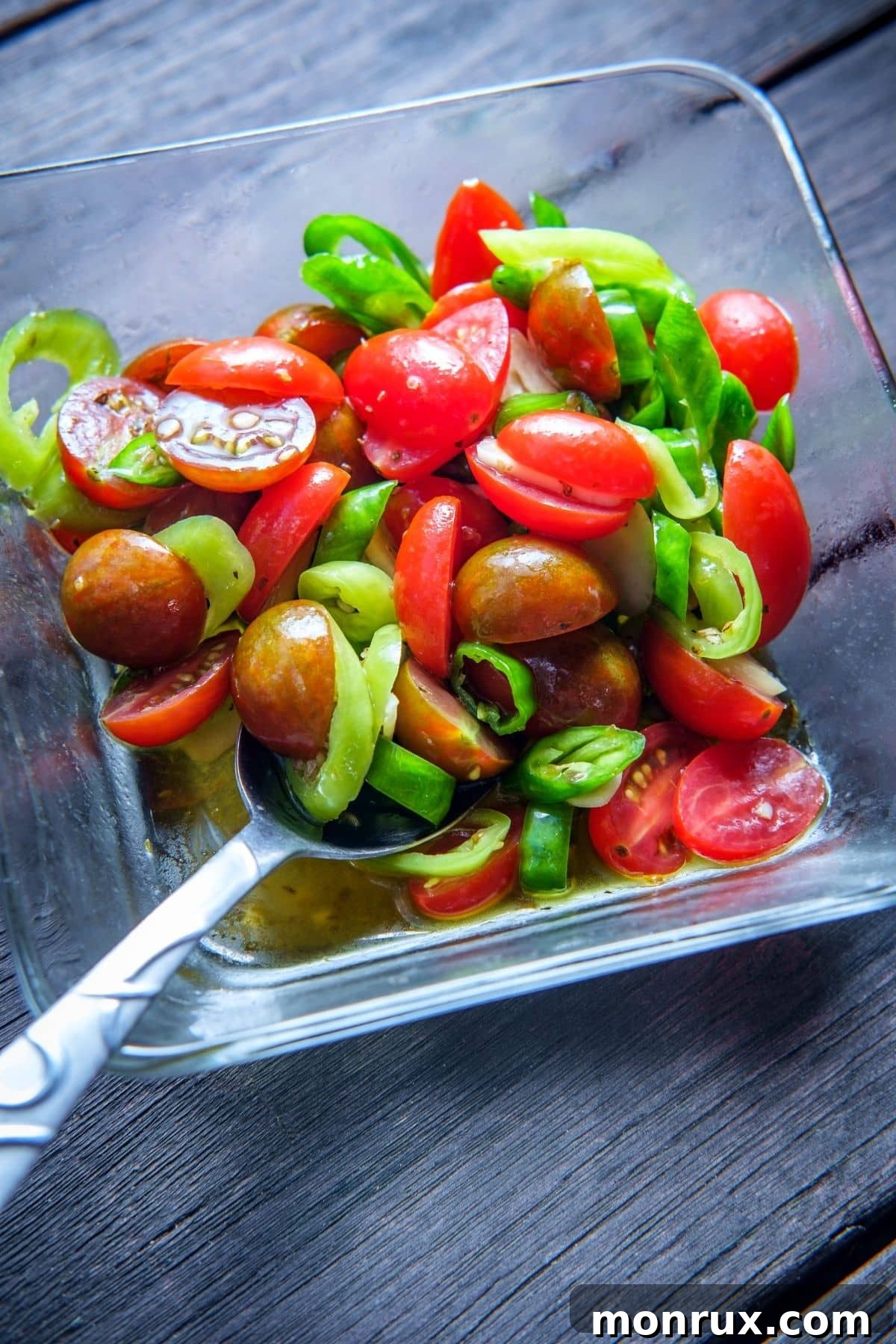 grape tomato salad, showcasing their vibrant color and round shape.