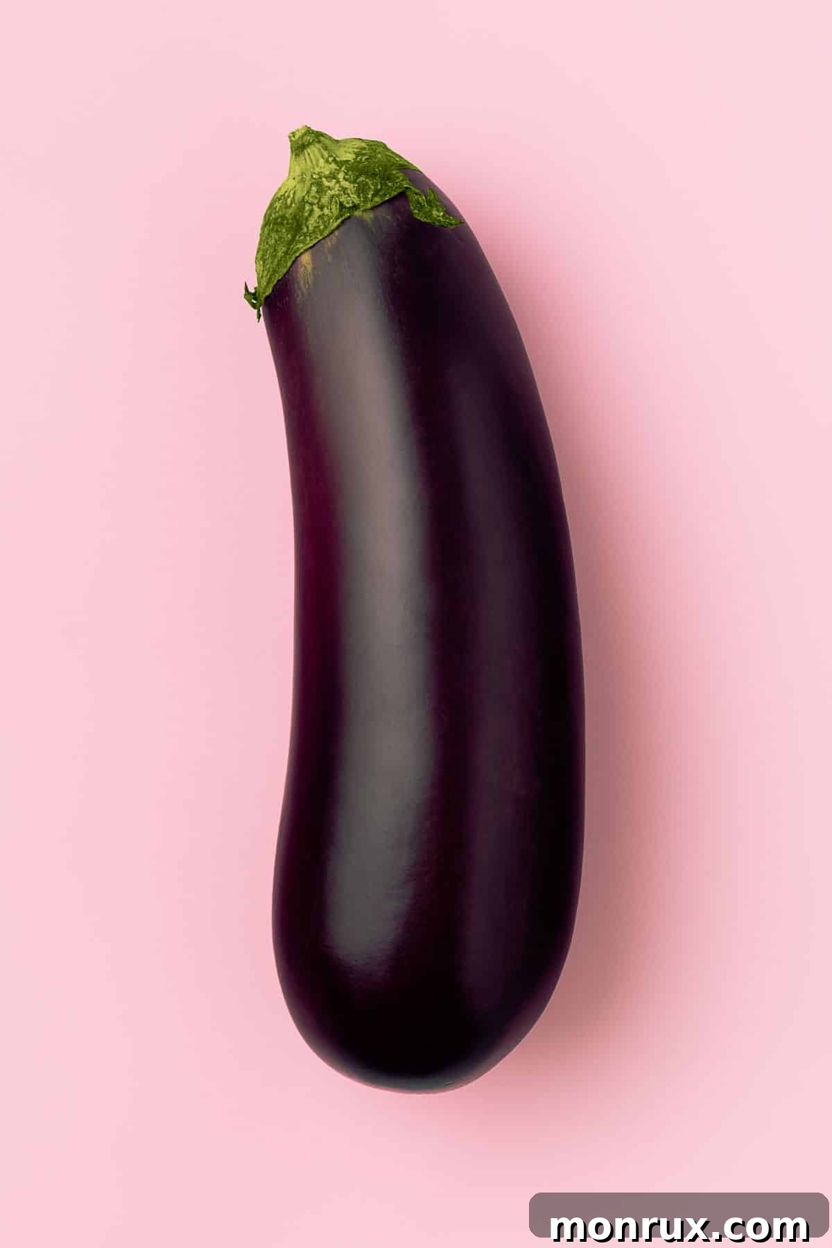 eggplant on table, displaying its rich purple hue.