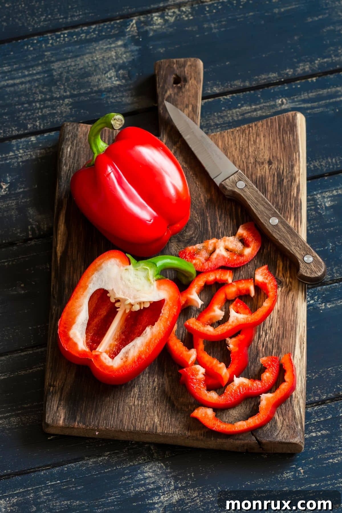 red bell pepper on cutting board, highlighting its vibrant color.