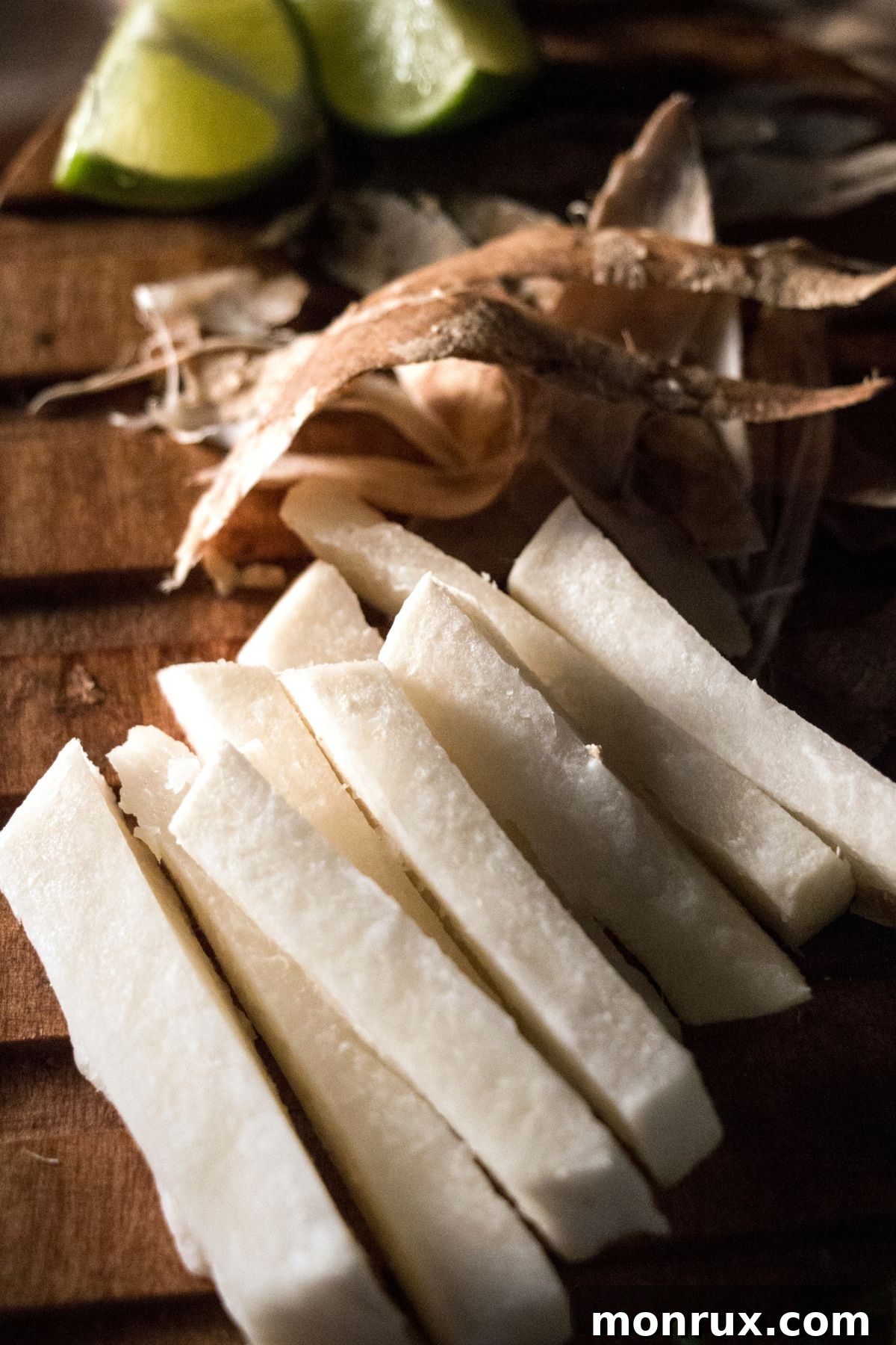 peeled and sliced jicama, showcasing its crisp texture.