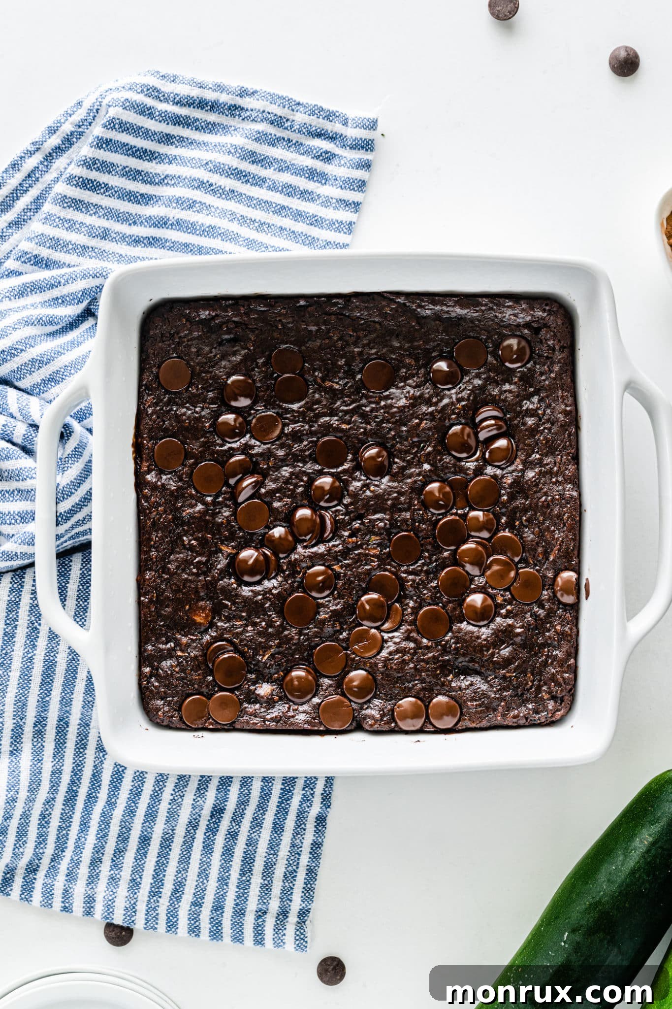 A perfectly baked pan of fudgy vegan zucchini brownies, ready to be sliced.