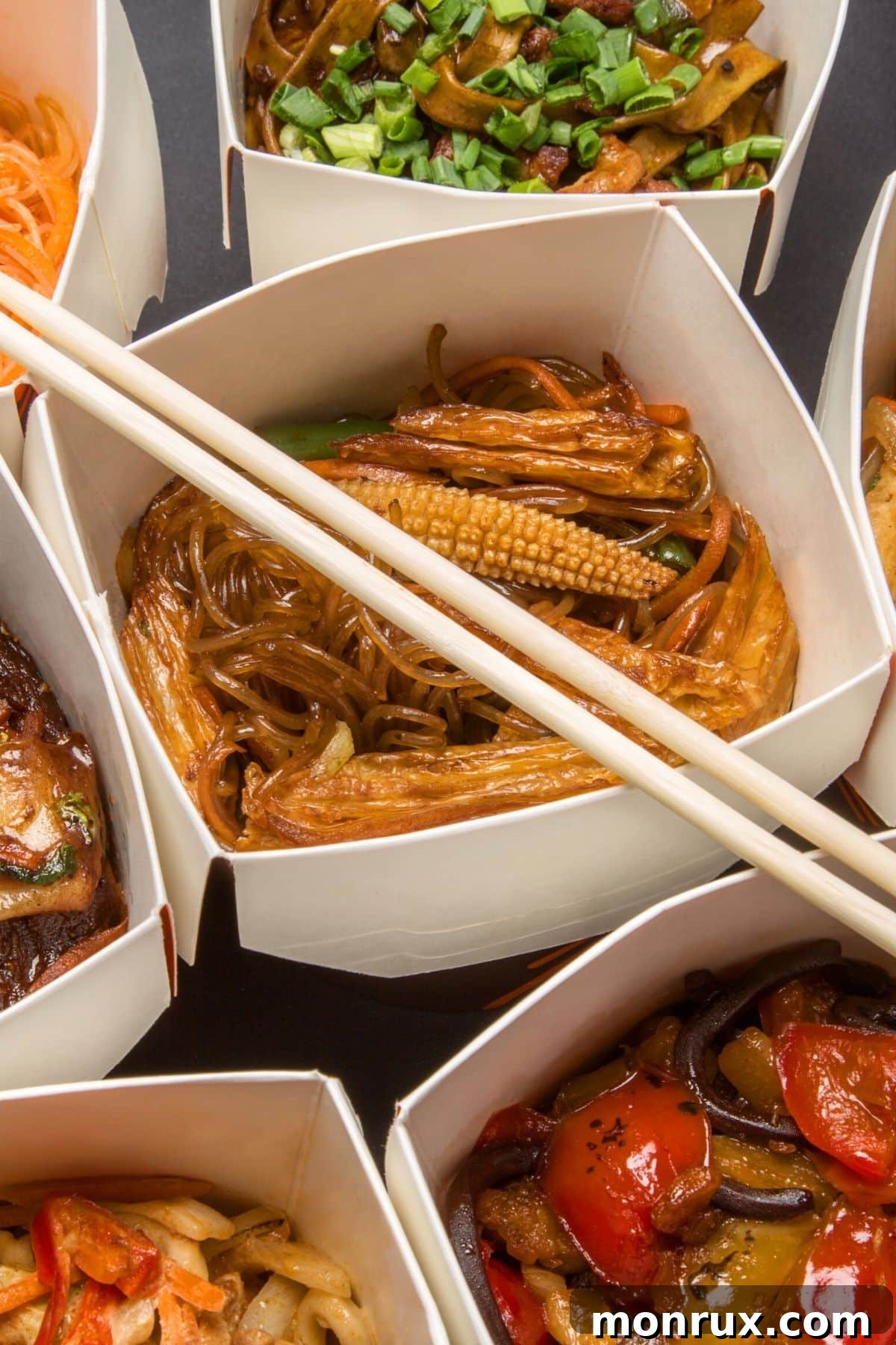 leftover chinese takeout in white containers.