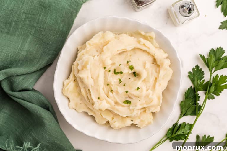 A top-down view of creamy Whole30 mashed potatoes in a bowl, ready to serve.
