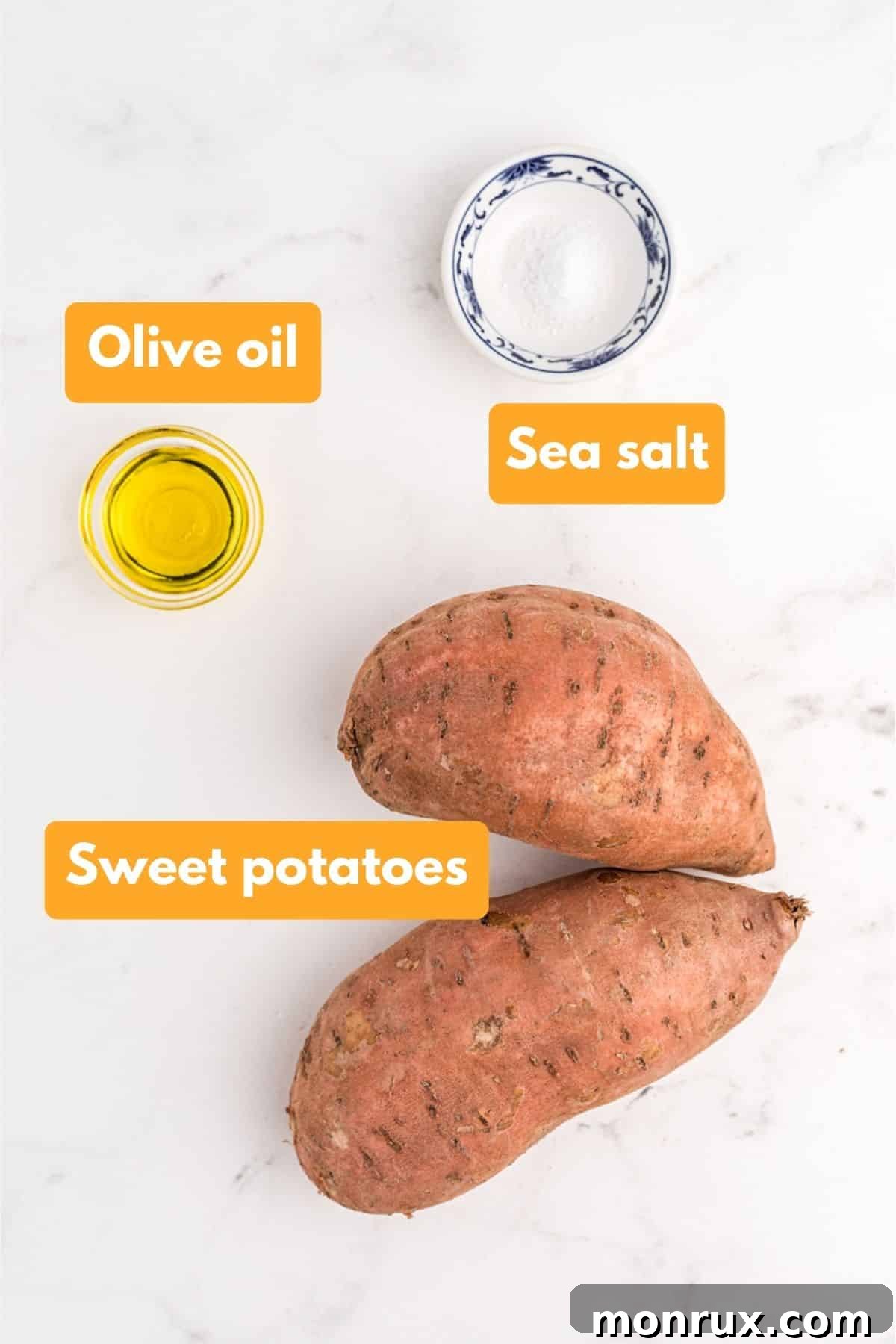A visual guide to the essential ingredients for making sweet potato jack o lanterns: fresh sweet potatoes, a bottle of olive oil, and a small dish of sea salt.