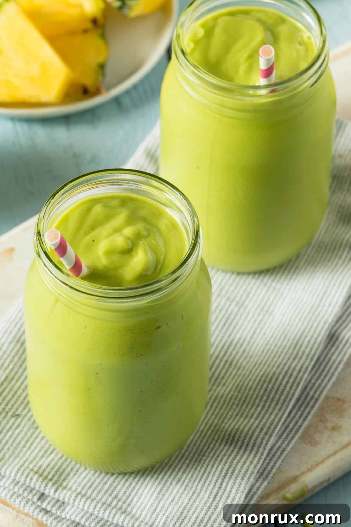 A refreshing green smoothie served on a table, highlighting healthy and natural ingredients.