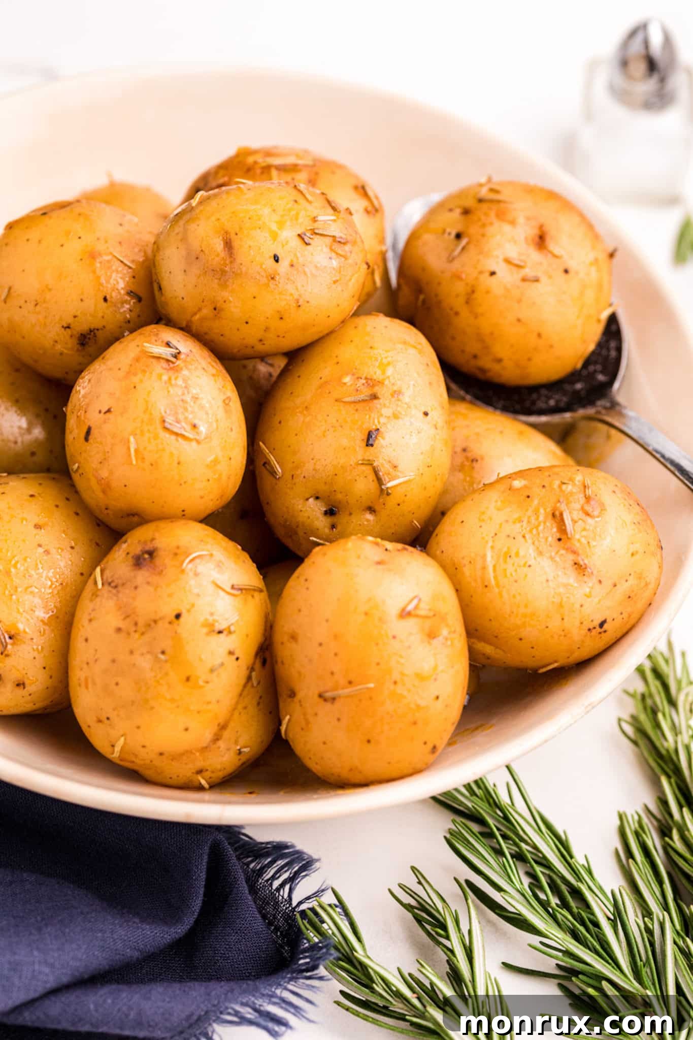Close-up of perfectly cooked new potatoes in a serving bowl, ready to be enjoyed.