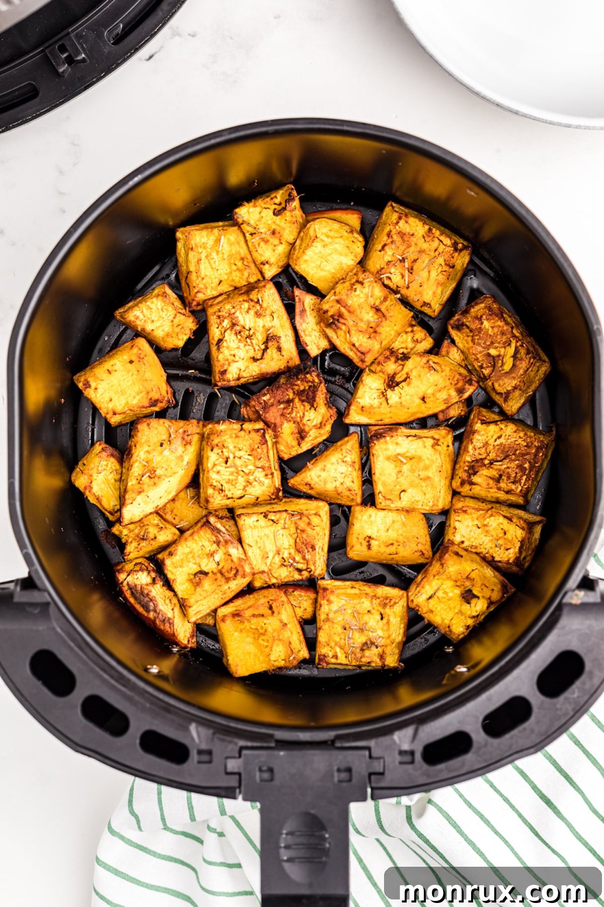 roasted pumpkin chunks in an air fryer.
