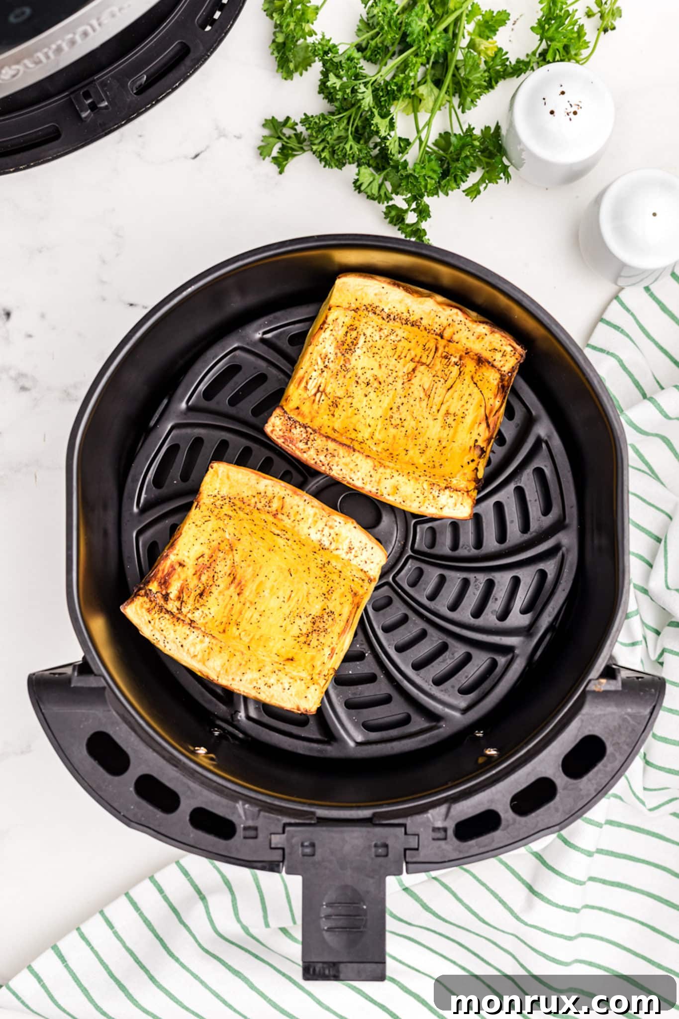 spaghetti squash cut in half in air fryer.