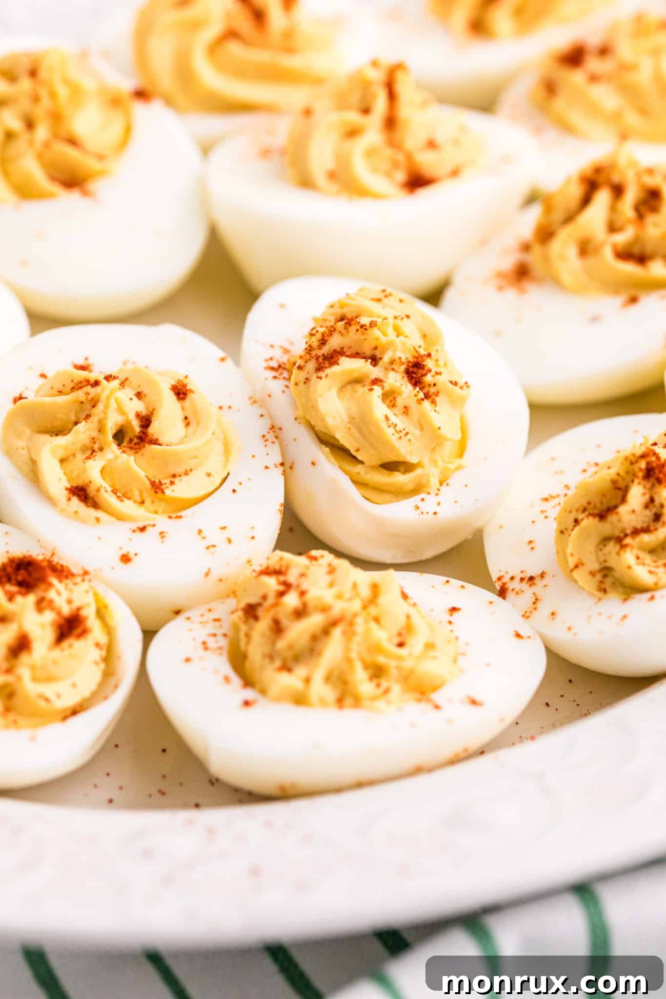 keto deviled eggs sprinkled with paprika.
