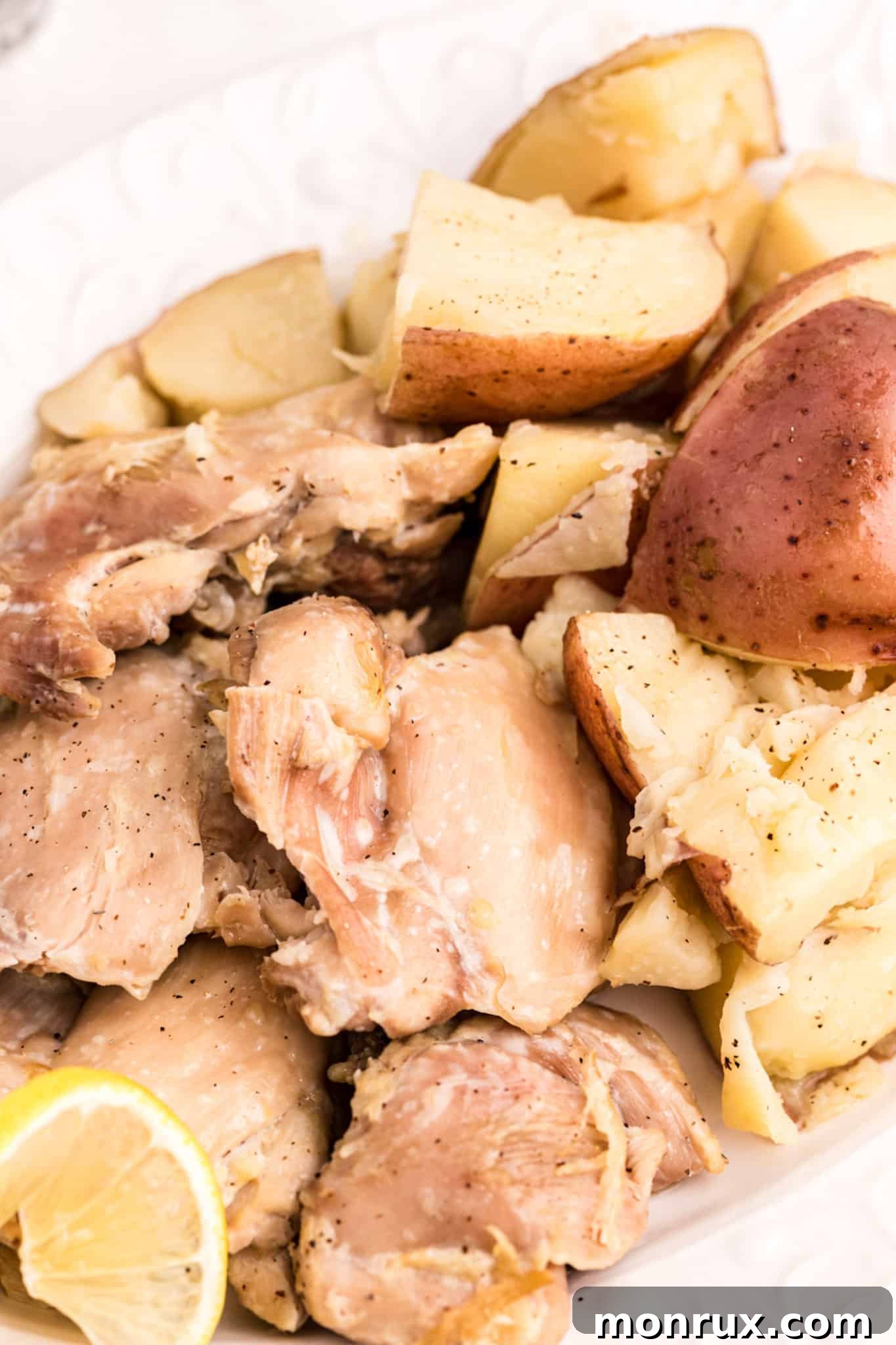 A serving dish filled with cooked Instant Pot chicken and potatoes, ready to be dished out.