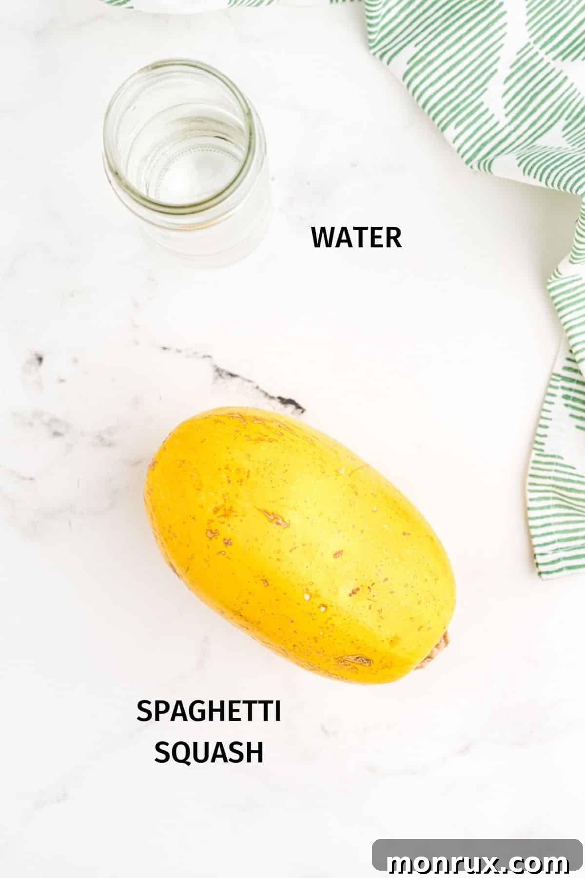 Two key ingredients for Instant Pot spaghetti squash: a whole squash and a measuring cup of water.