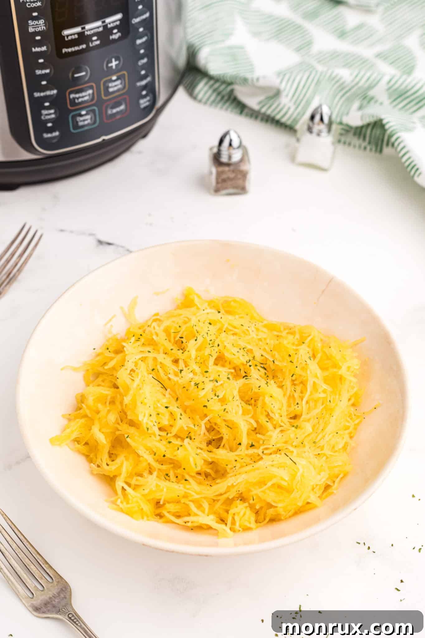 Cooked Instant Pot spaghetti squash served in a bowl, ready for toppings.