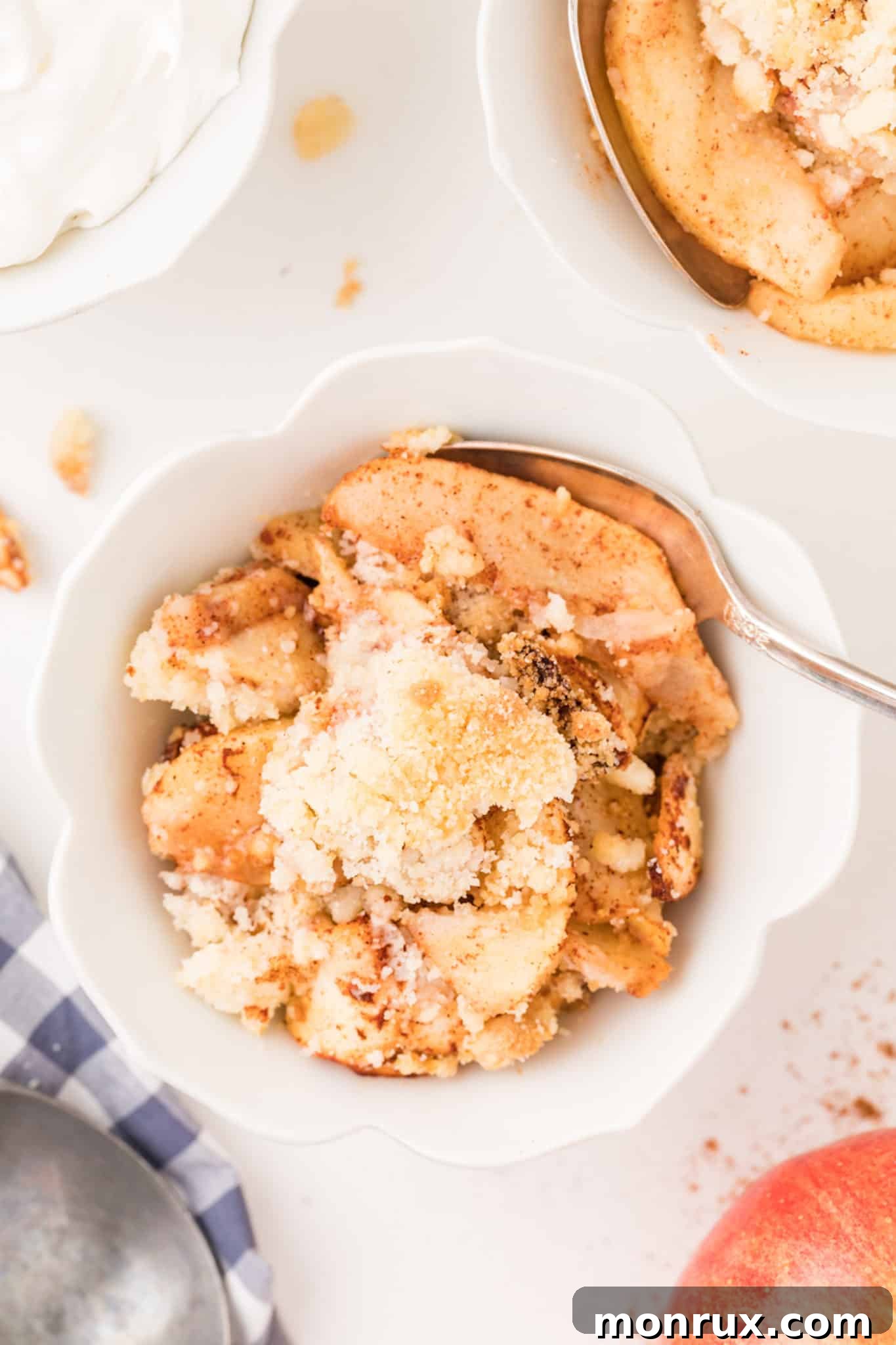 A single bowl of air fryer apple crisp with a perfect golden crumble topping, ready to be served.