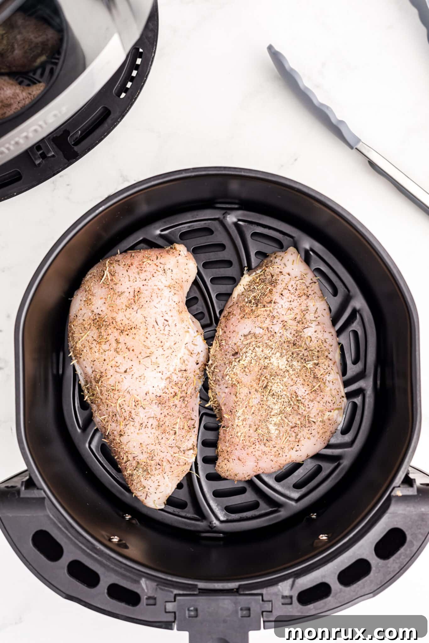 turkey tenderloins in air fryer basket.