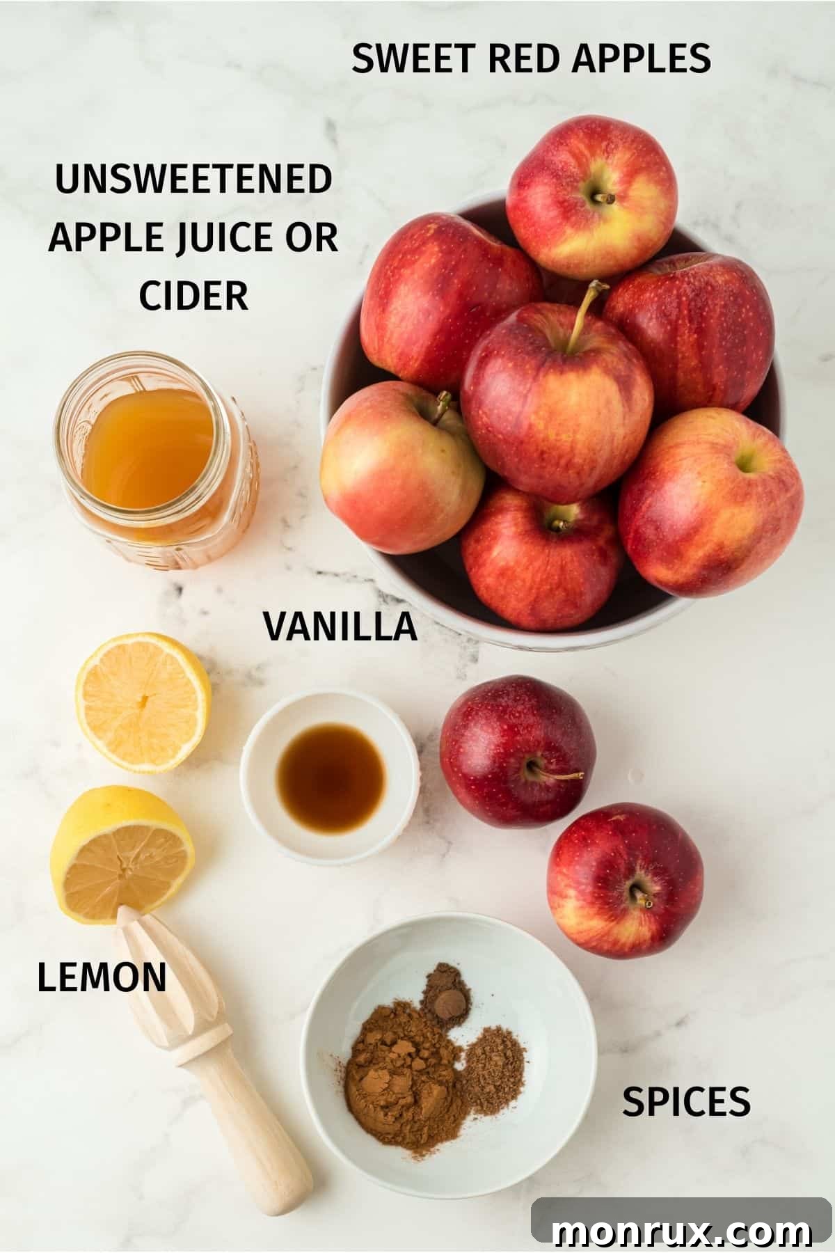 Key ingredients for making apple butter including apples, apple cider, and spices.
