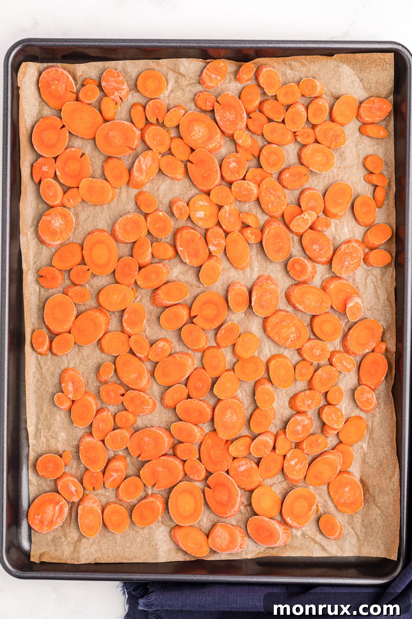 frozen carrots on a sheet pan, ready for long-term storage.