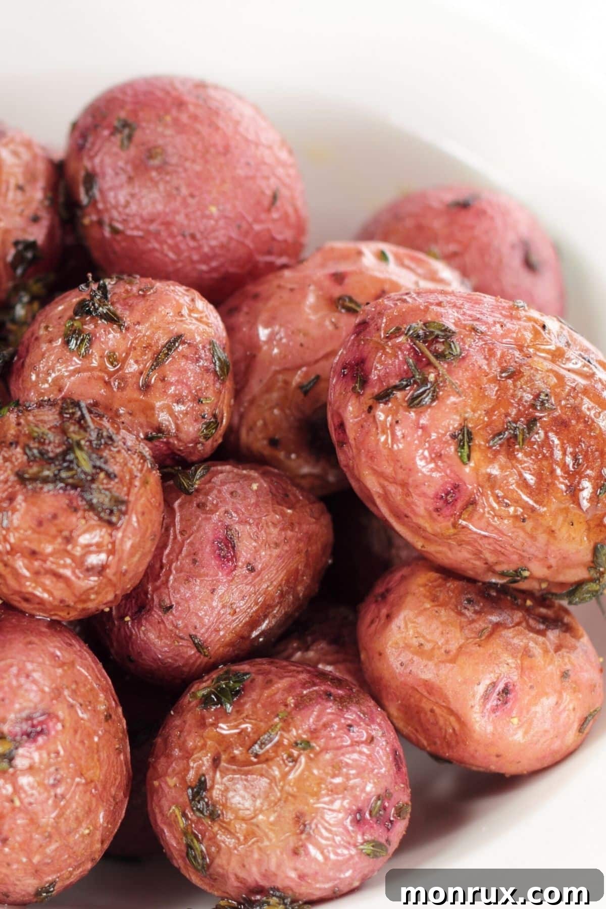 bowl of whole roasted air fryer red baby potatoes.