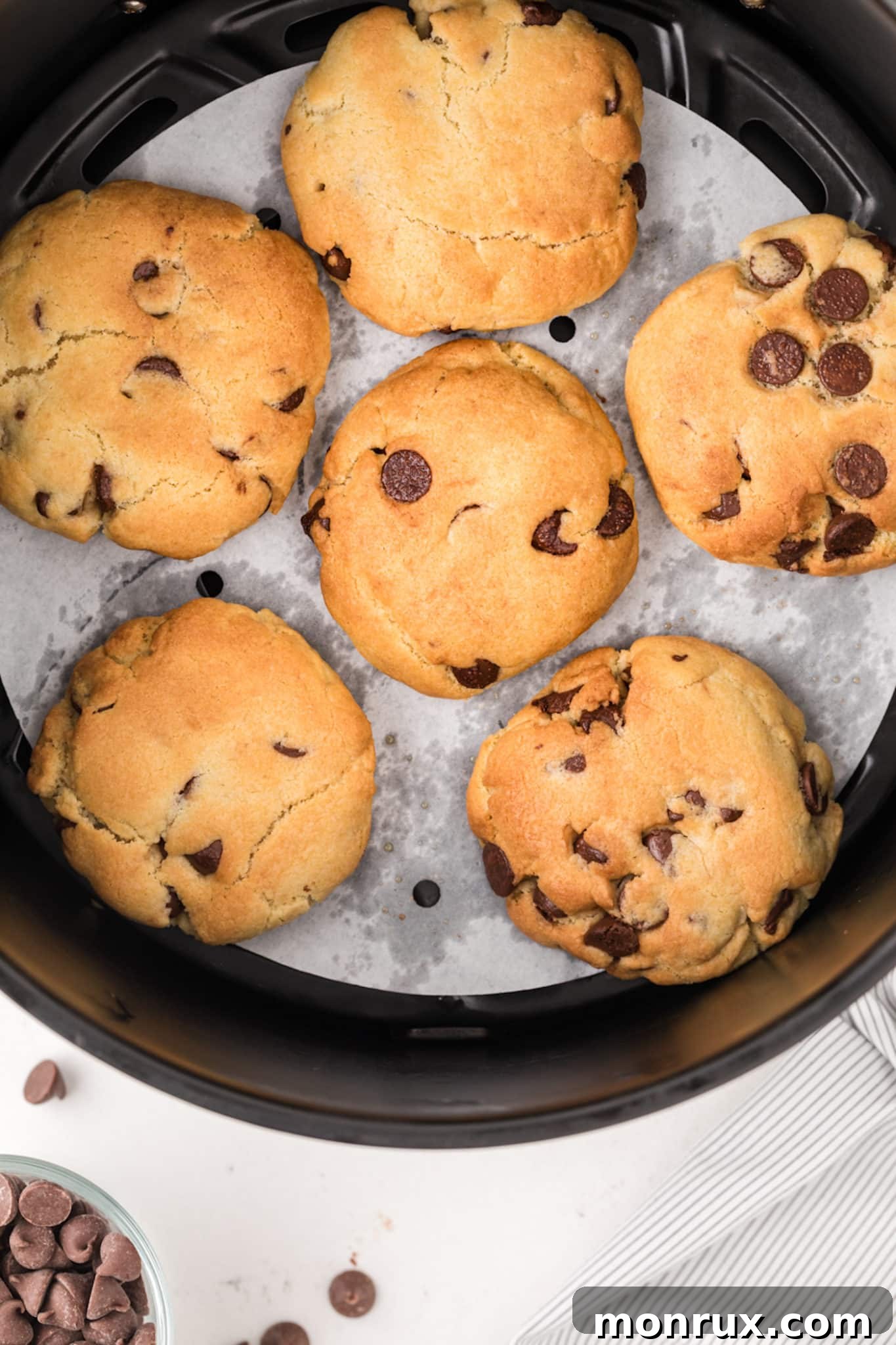 Perfectly baked air fryer chocolate chip cookies cooling on a wire rack.