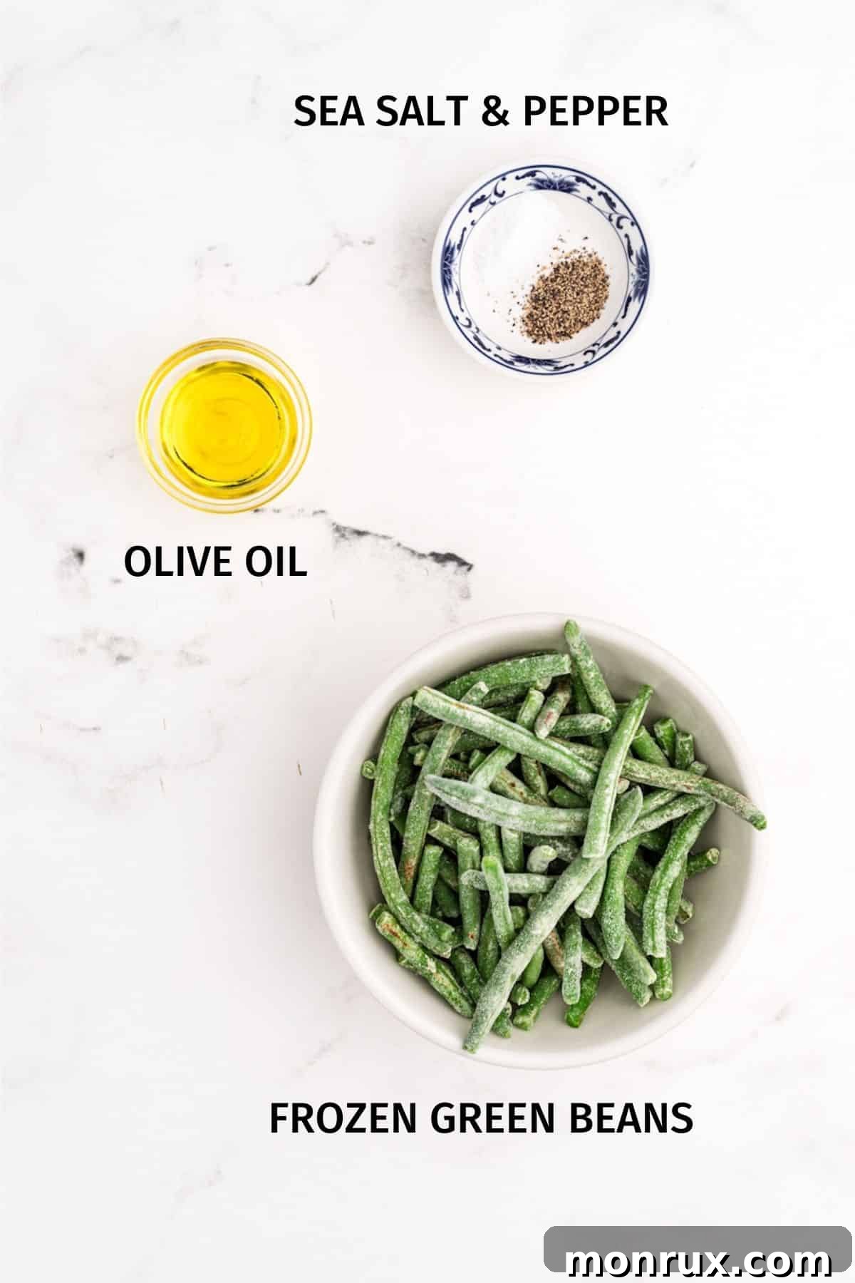 A selection of ingredients for air fryer green beans, including a bag of frozen green beans, olive oil, and various spices.