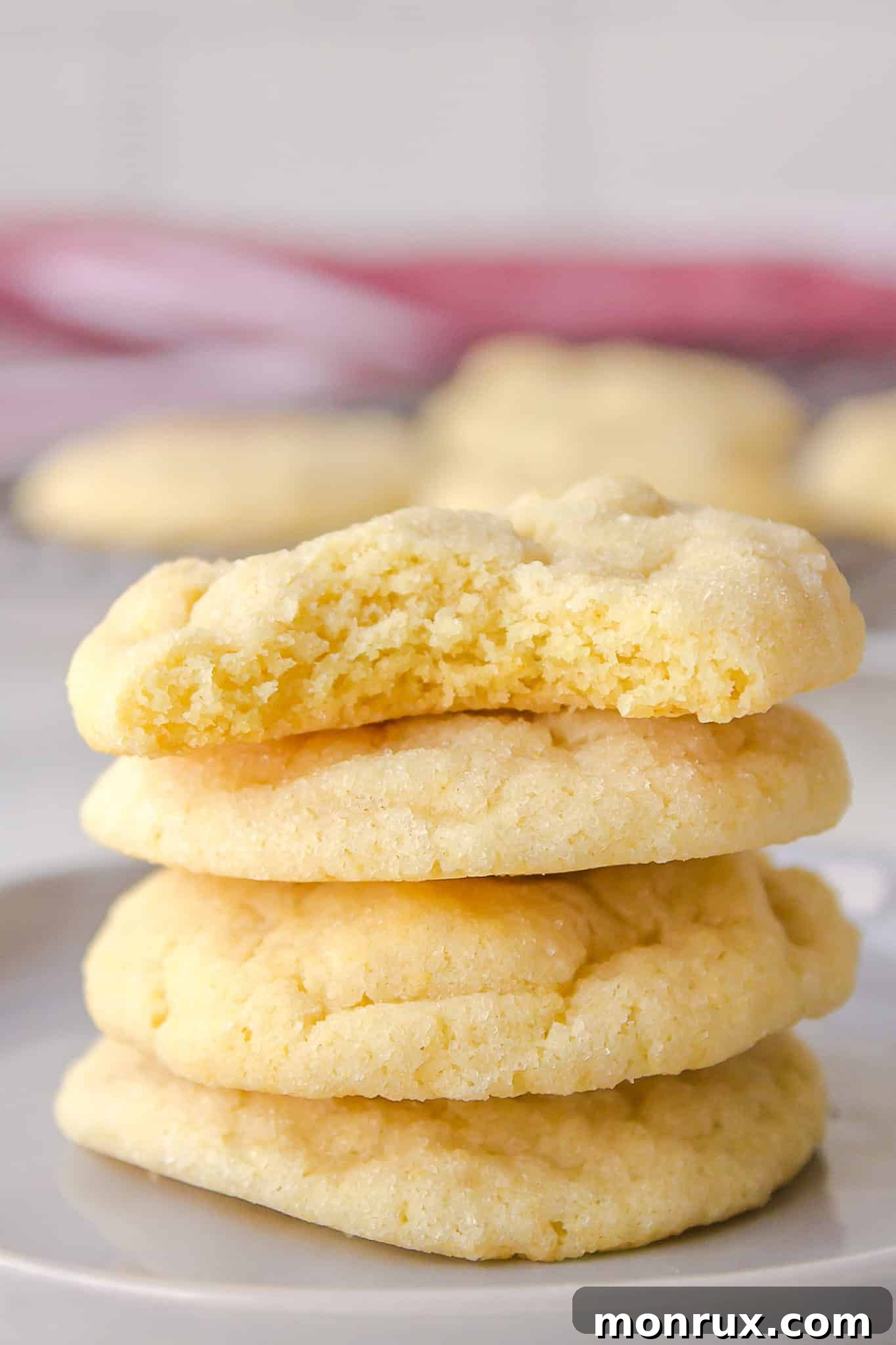 Stack of freshly baked dairy-free sugar cookies with a classic crackled top, appealing and delicious.
