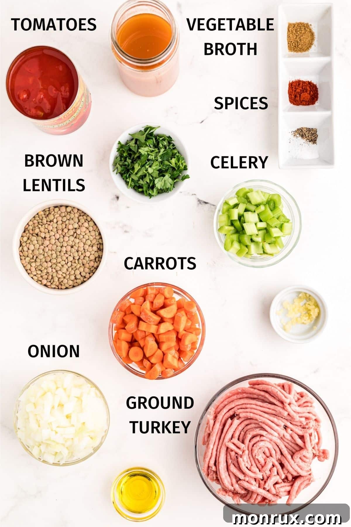Essential ingredients laid out for making delicious turkey and lentil soup, including fresh vegetables, ground turkey, and lentils.
