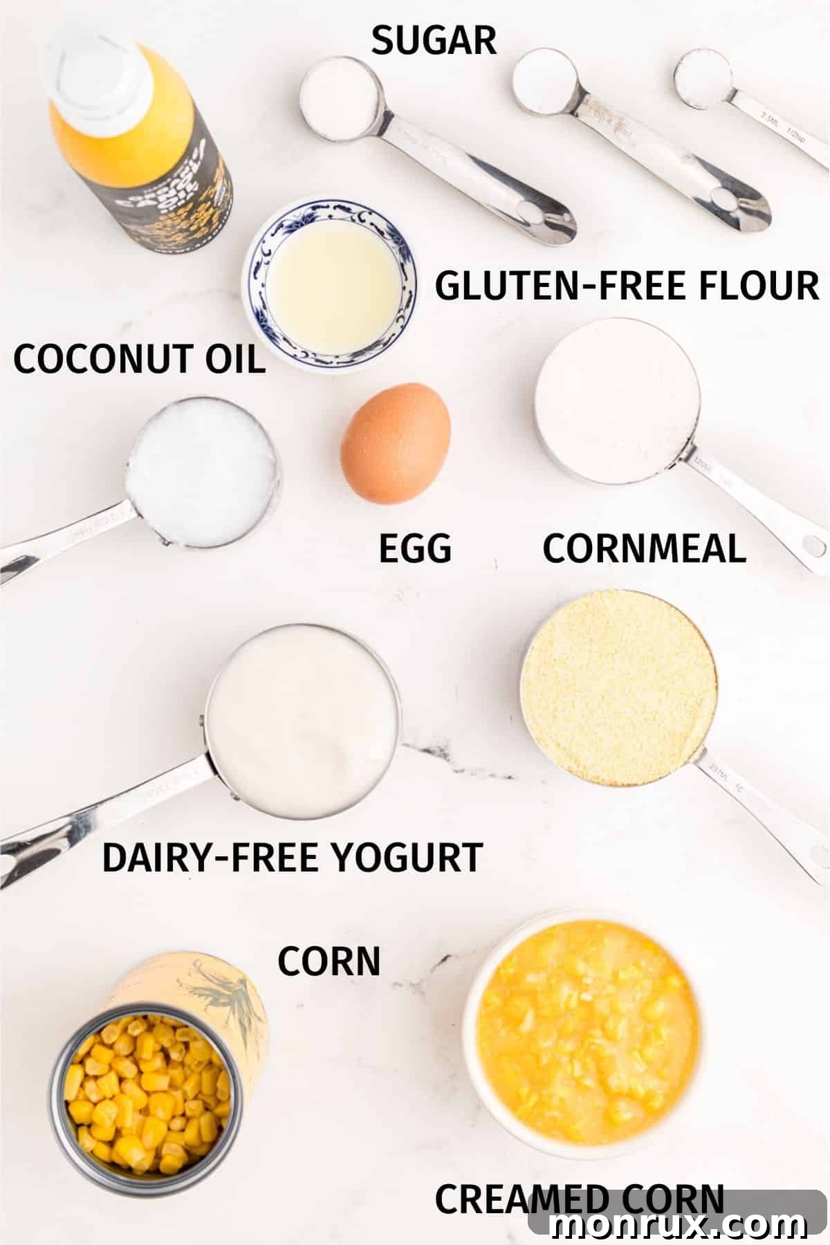 Collection of key ingredients for dairy-free corn casserole laid out on a kitchen counter.