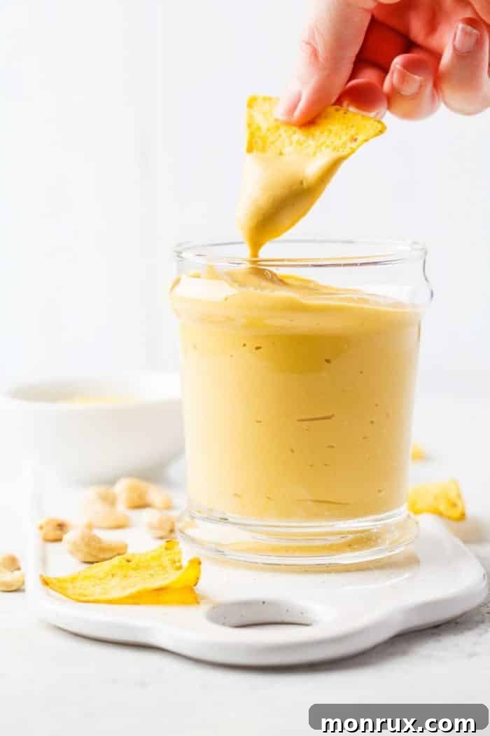 Vegan cashew cheese sauce as a dip with corn chips