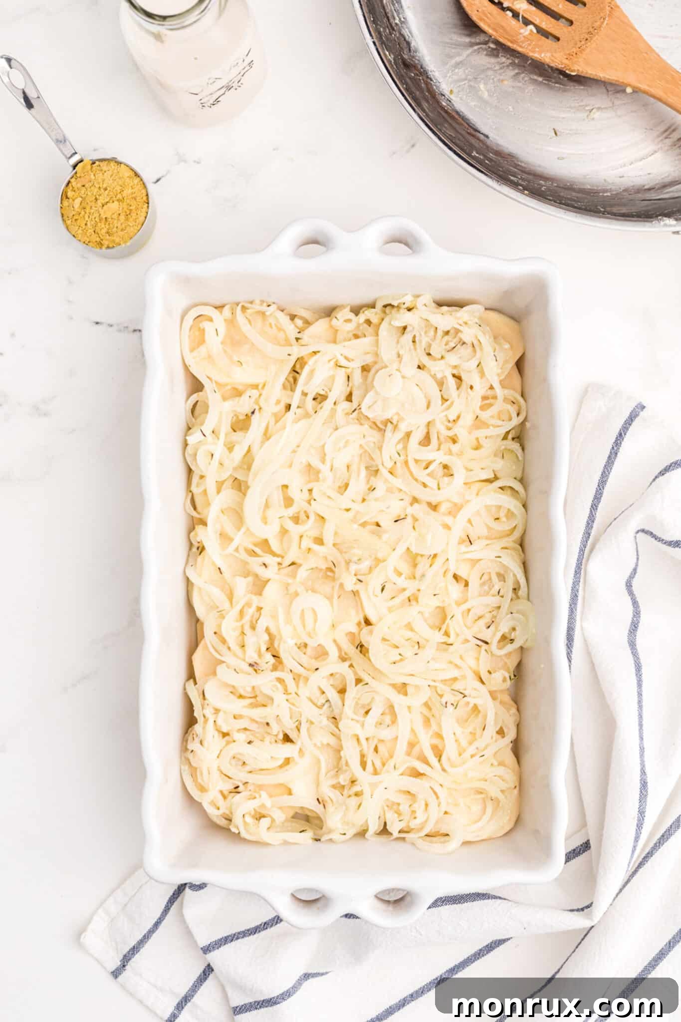 layers in baking dish for dairy-free scalloped potatoes.