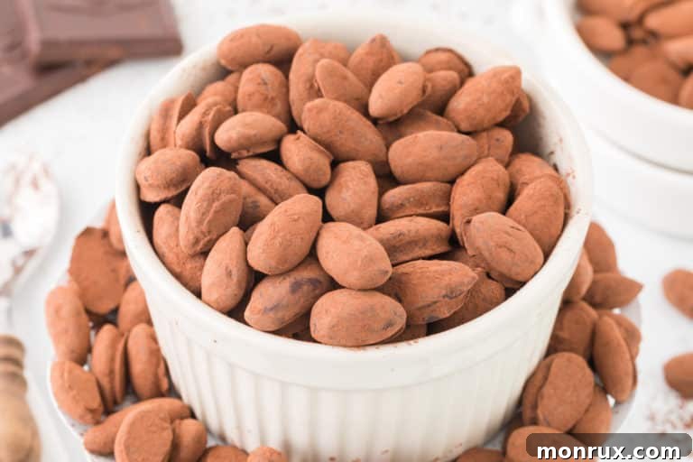 a bowl of chocolate covered almonds