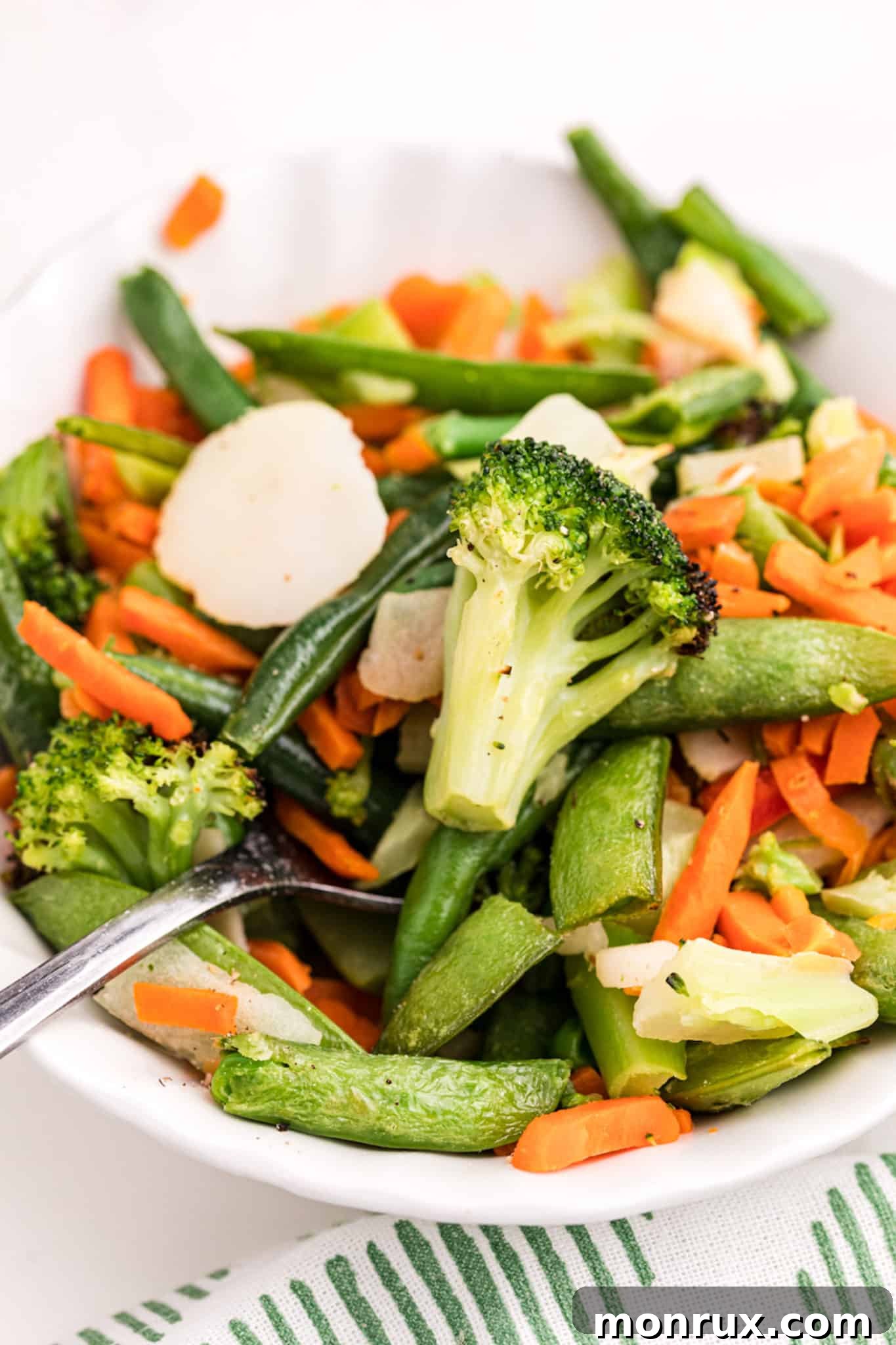 A bowl of roasted air-fried mixed vegetables, ready to be served.