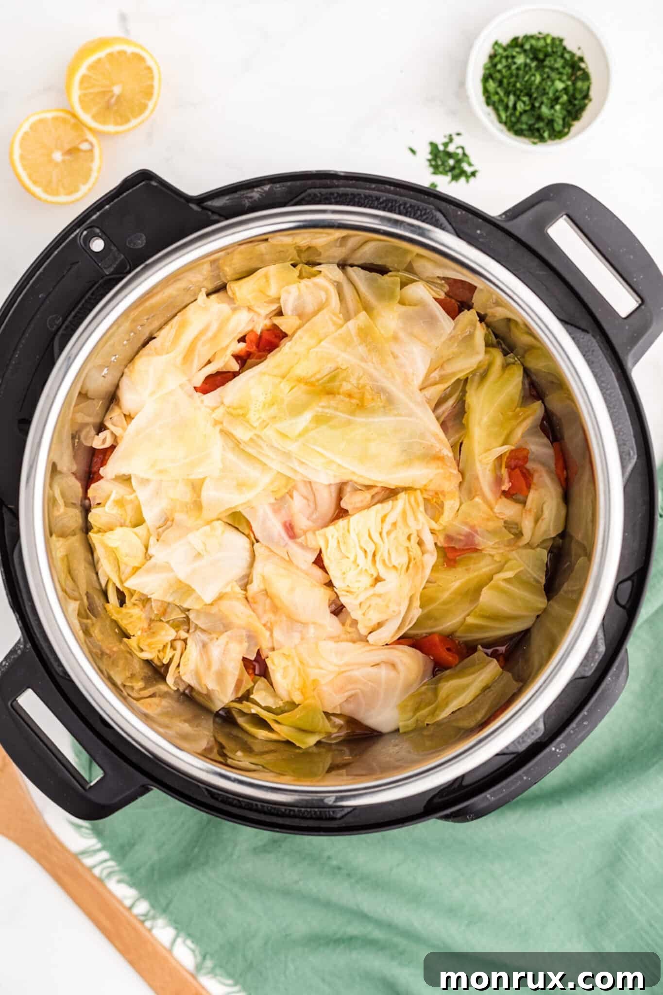Cabbage soup cooking inside an Instant Pot with the lid secured.