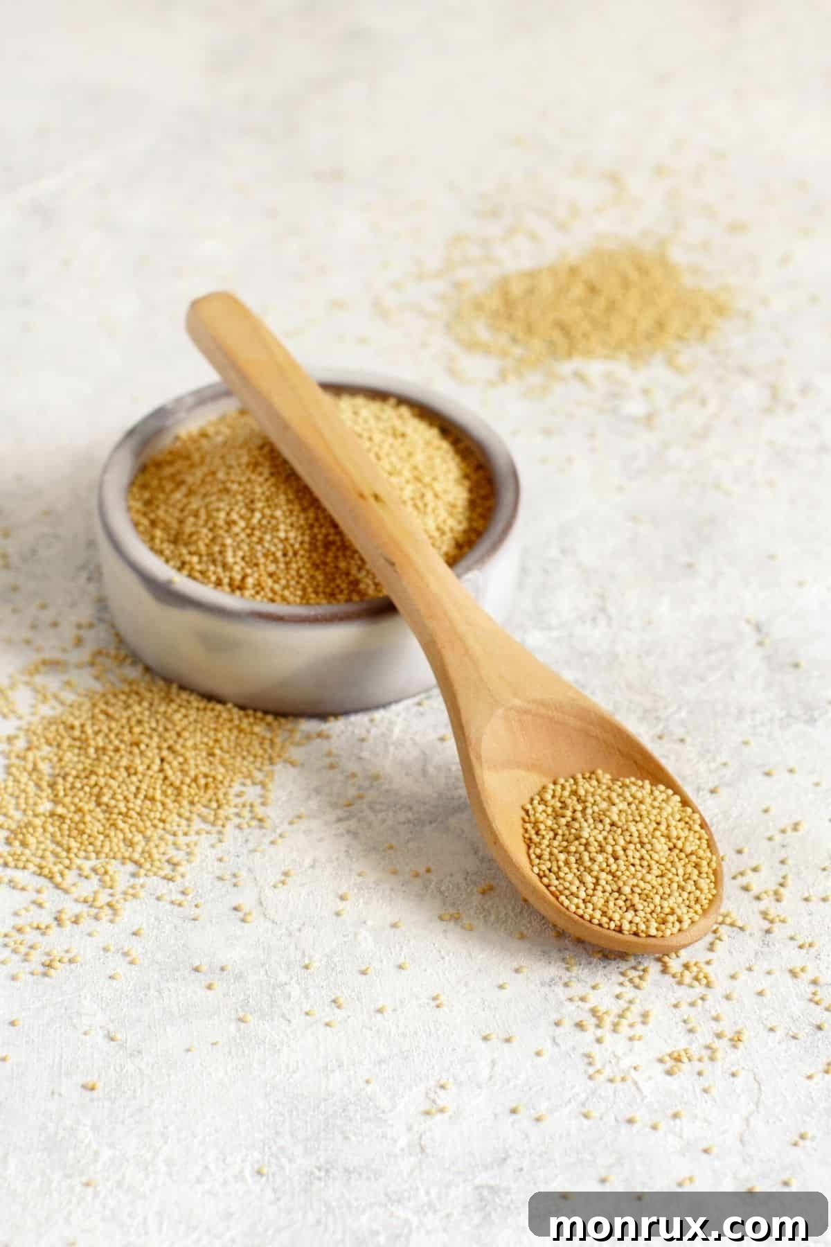 A bowl filled with cooked amaranth grains, showcasing its distinct texture.