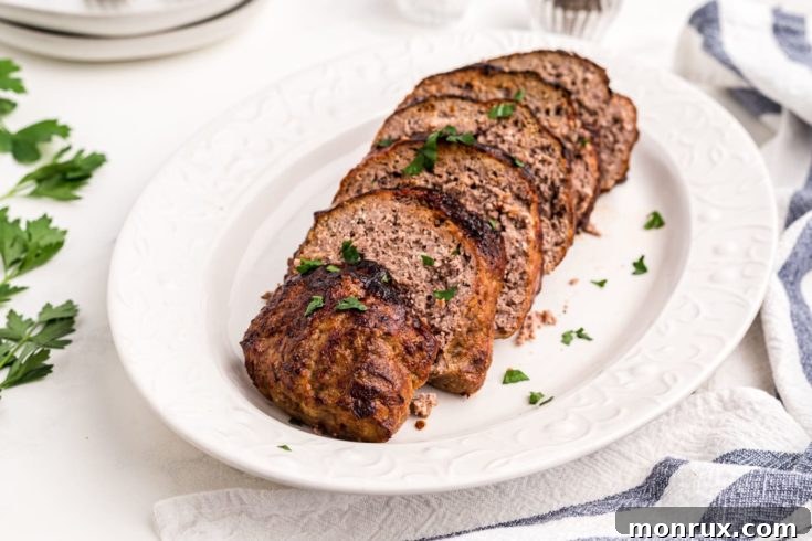 Keto meatloaf slice on a plate, cooked in an air fryer.
