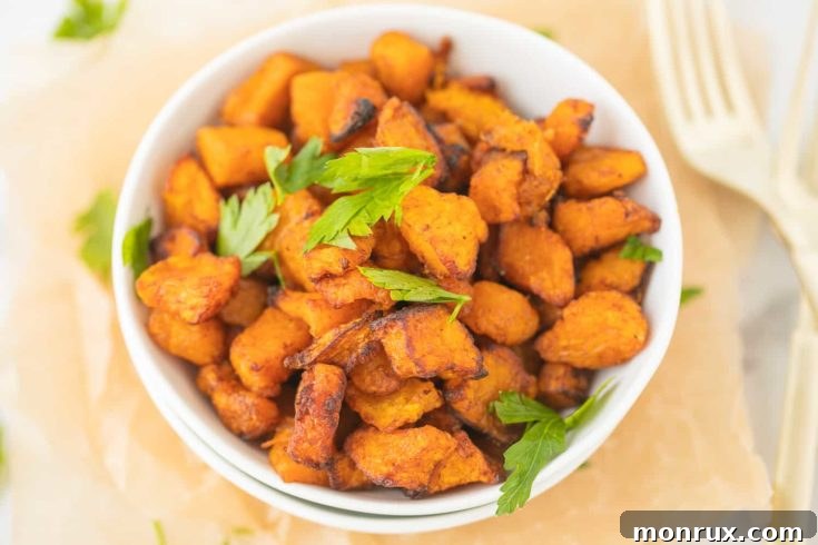 Roasted butternut squash cubes with cinnamon from an air fryer.
