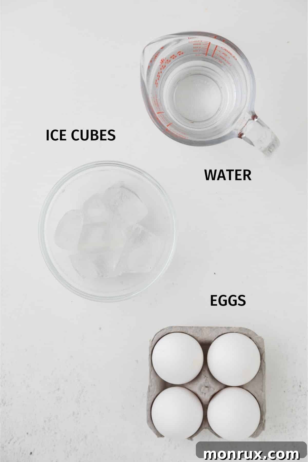 Ingredients for air fryer soft boiled eggs: eggs, ice cubes, and water.