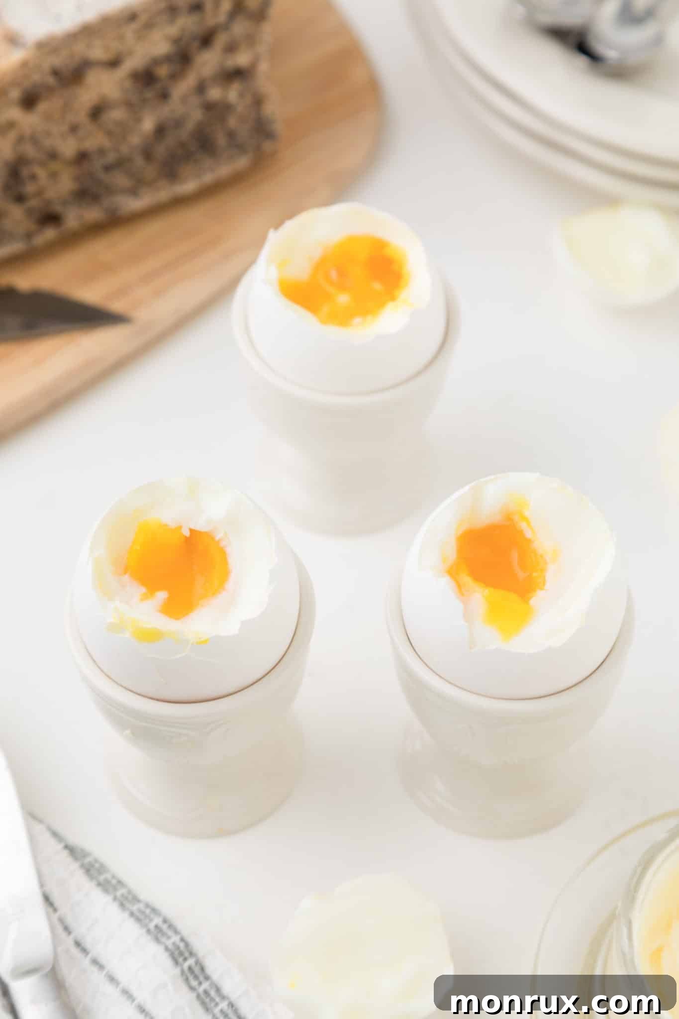 Soft boiled eggs served elegantly in egg cups, ready for breakfast.