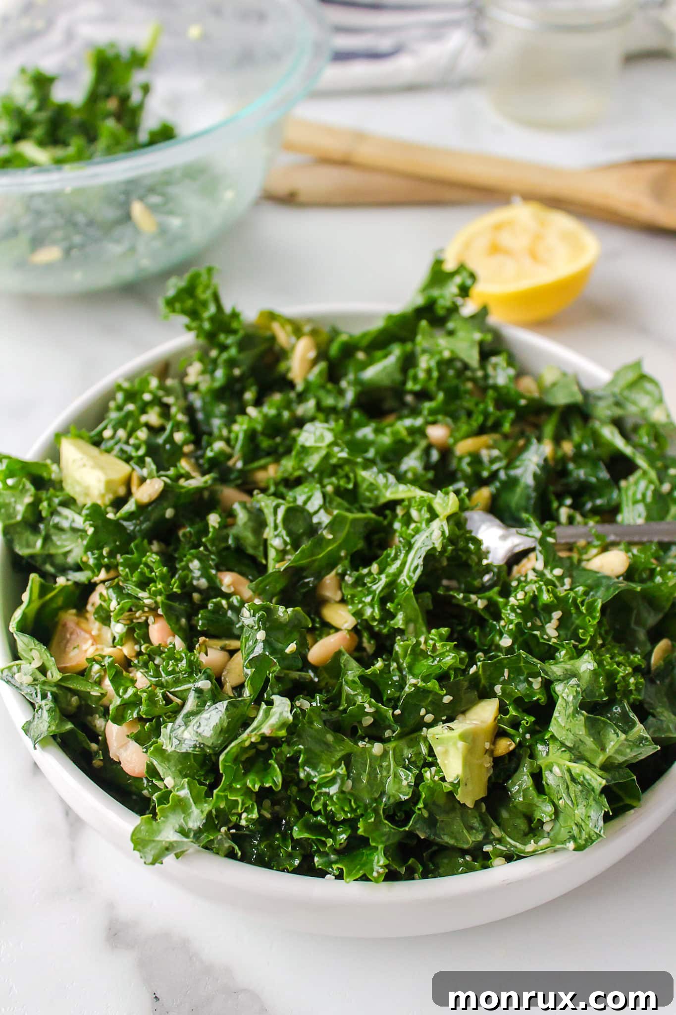 A beautifully presented bowl of homemade Erewhon white bean kale salad, ready to be enjoyed.