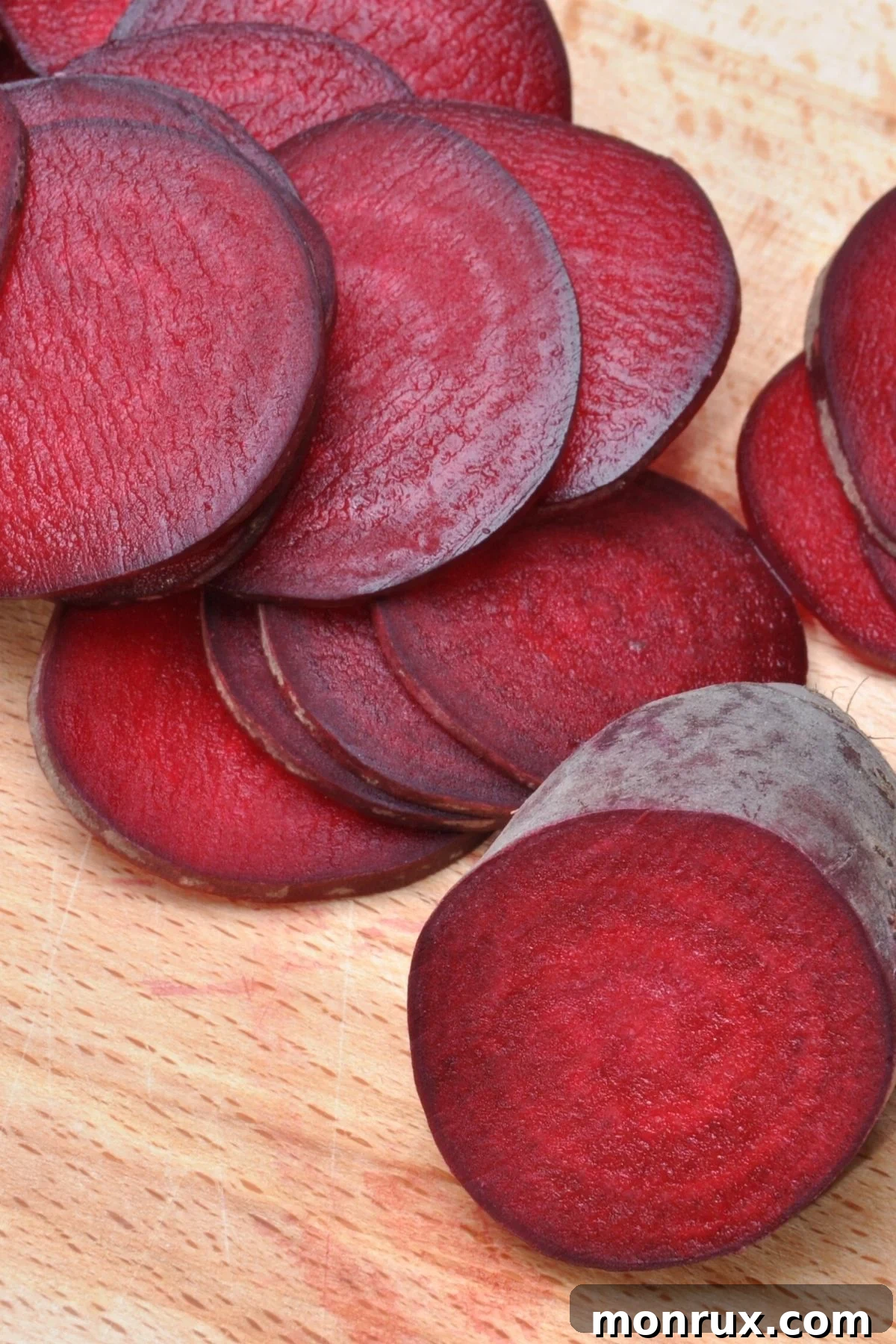Thinly sliced beets, prepped for dehydration to make beet powder.