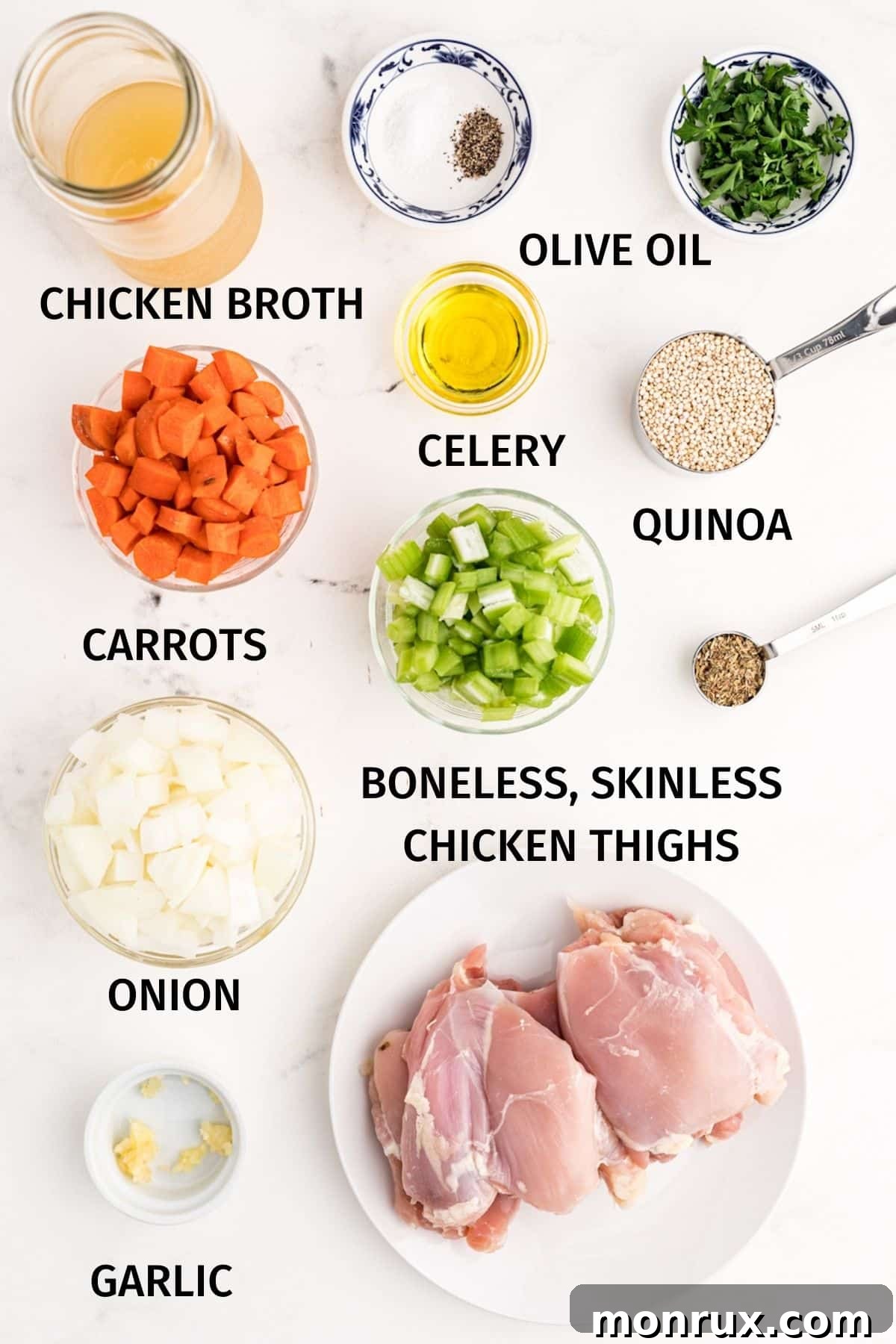 Close-up shot of the fresh ingredients for chicken quinoa dinner with colorful vegetables and chicken thighs.