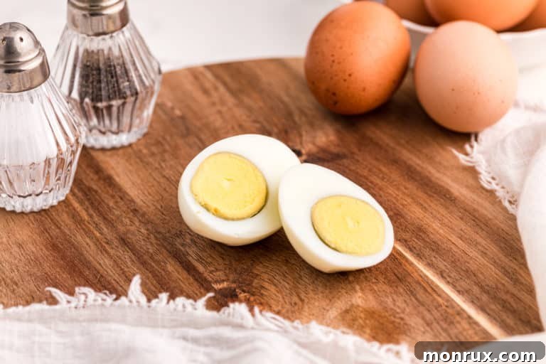 Sliced hard-boiled eggs, showing perfectly cooked yolks and whites.