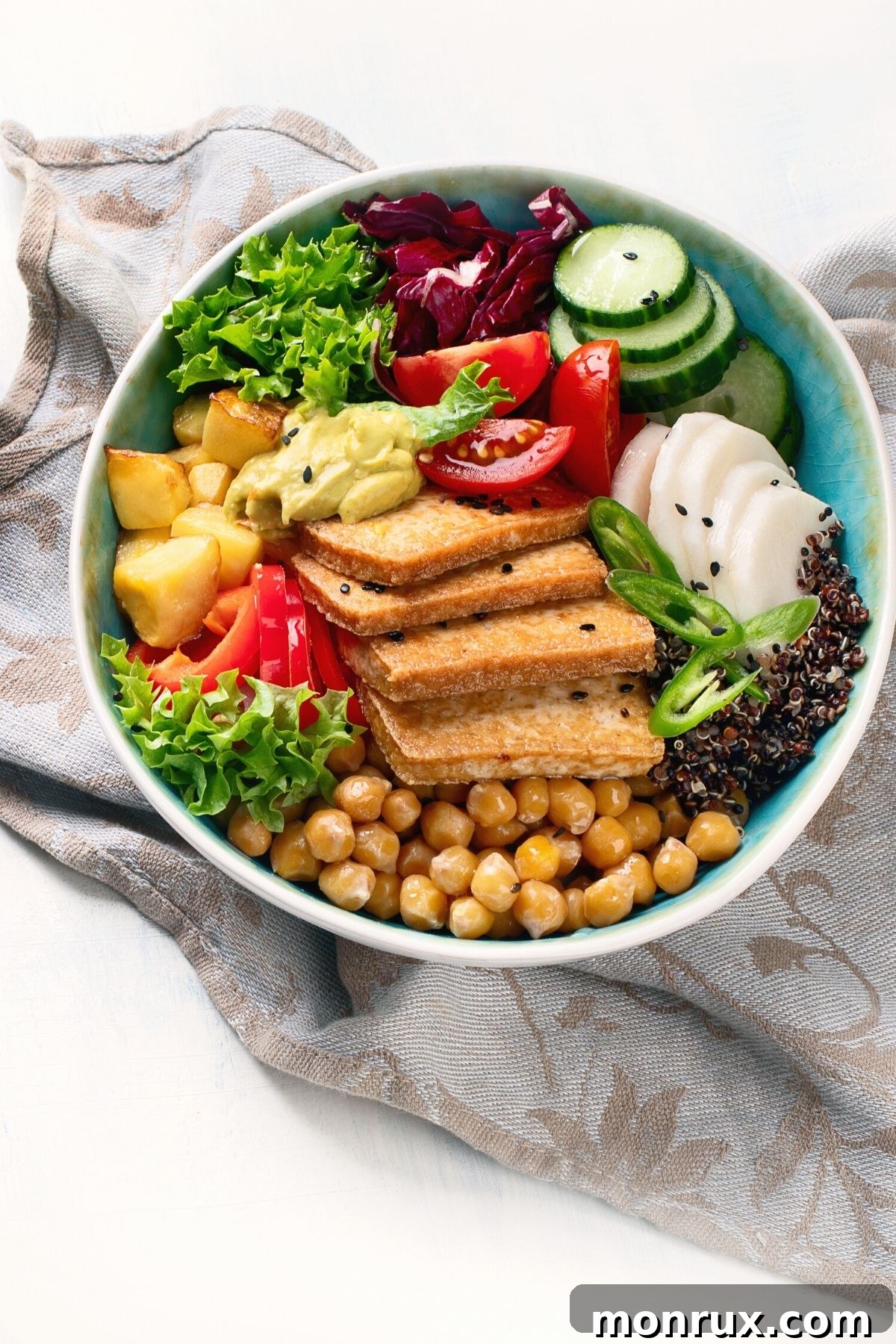 Delicious vegan bowl featuring crispy air-fried tofu, fresh greens, and vibrant vegetables