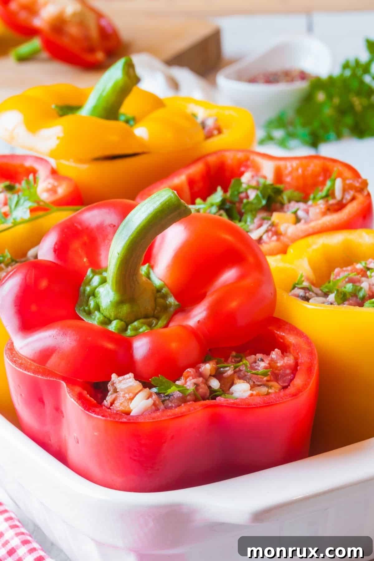Close-up of freshly baked stuffed peppers in a casserole dish, ready to be served.