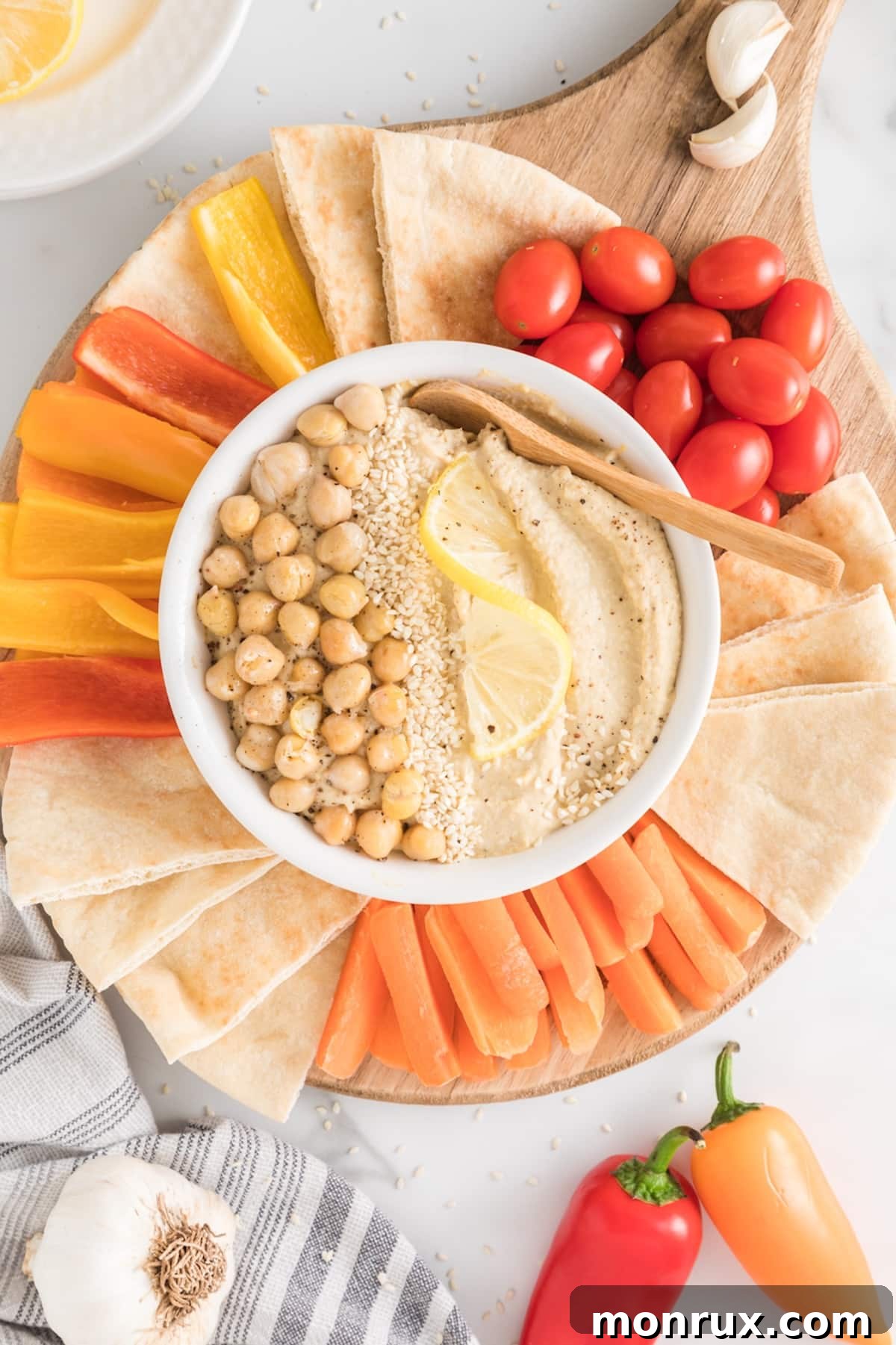 hummus snack platter with colorful vegetables.