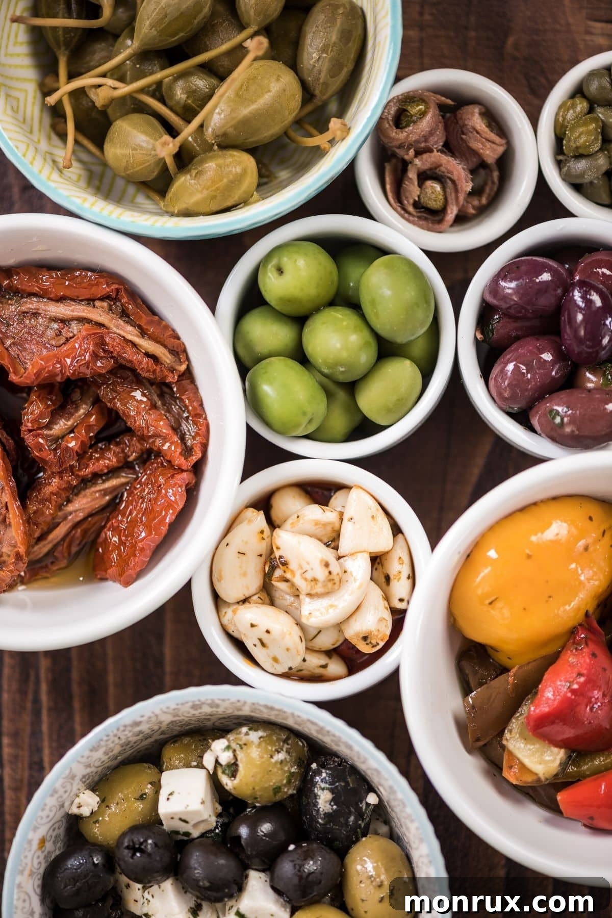 An inviting spread of traditional Spanish tapas, including a refreshing plate of sliced Spanish oranges, perfect for sharing.