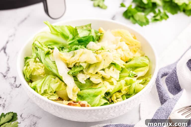 A wide angle shot of air fryer cooked cabbage in a white bowl.